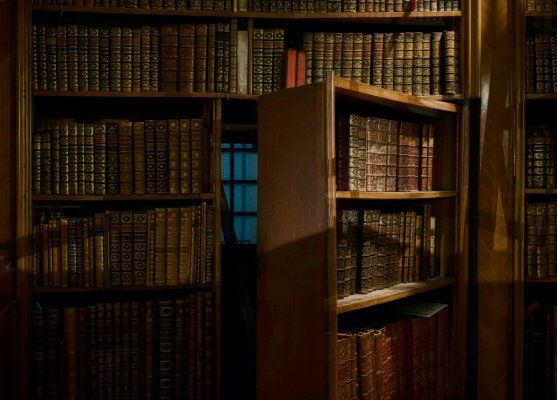 A hidden doorway behind a bookshelf