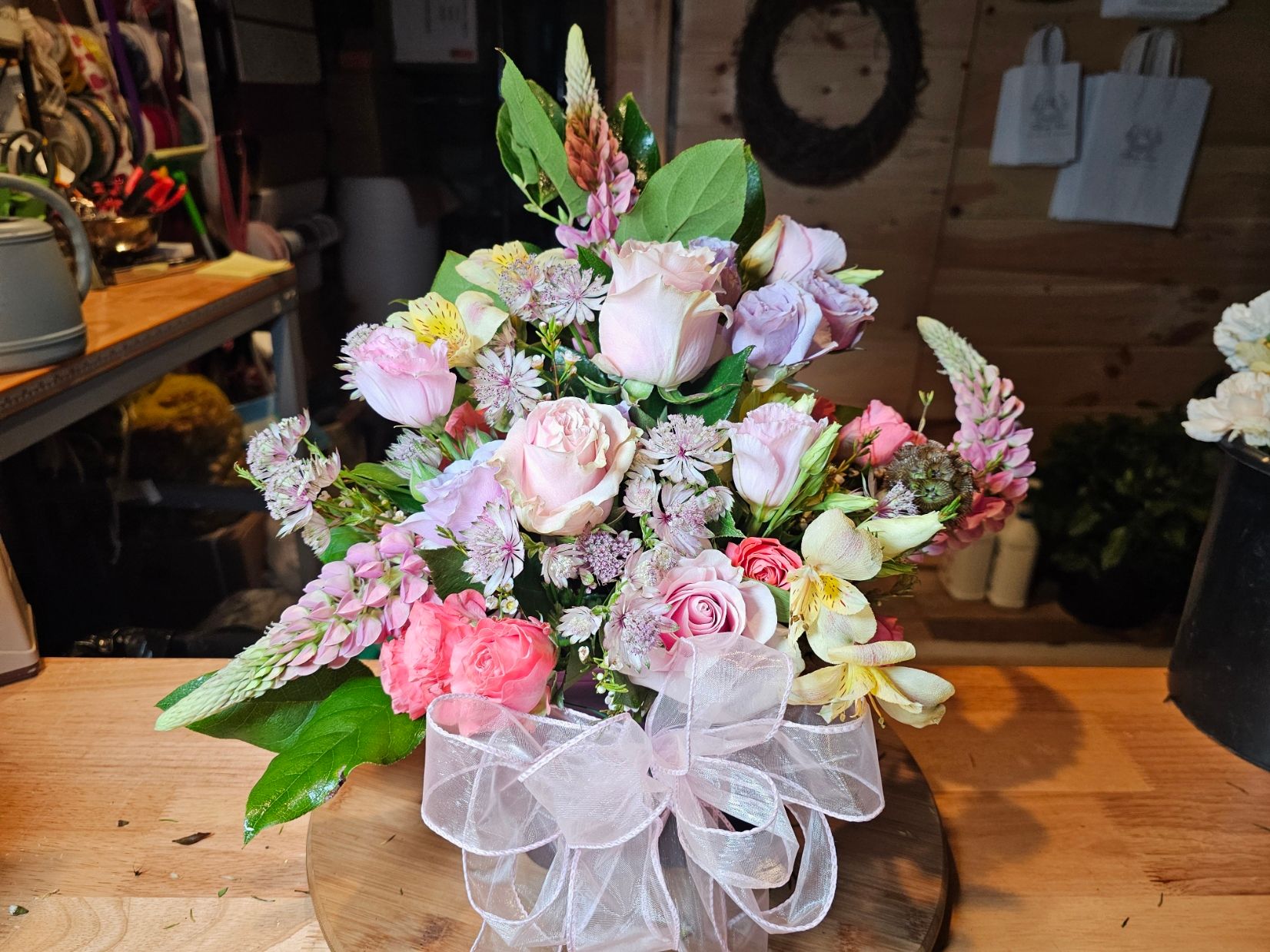 Pink bouquet with translucent ribbon and garden-style blooms
