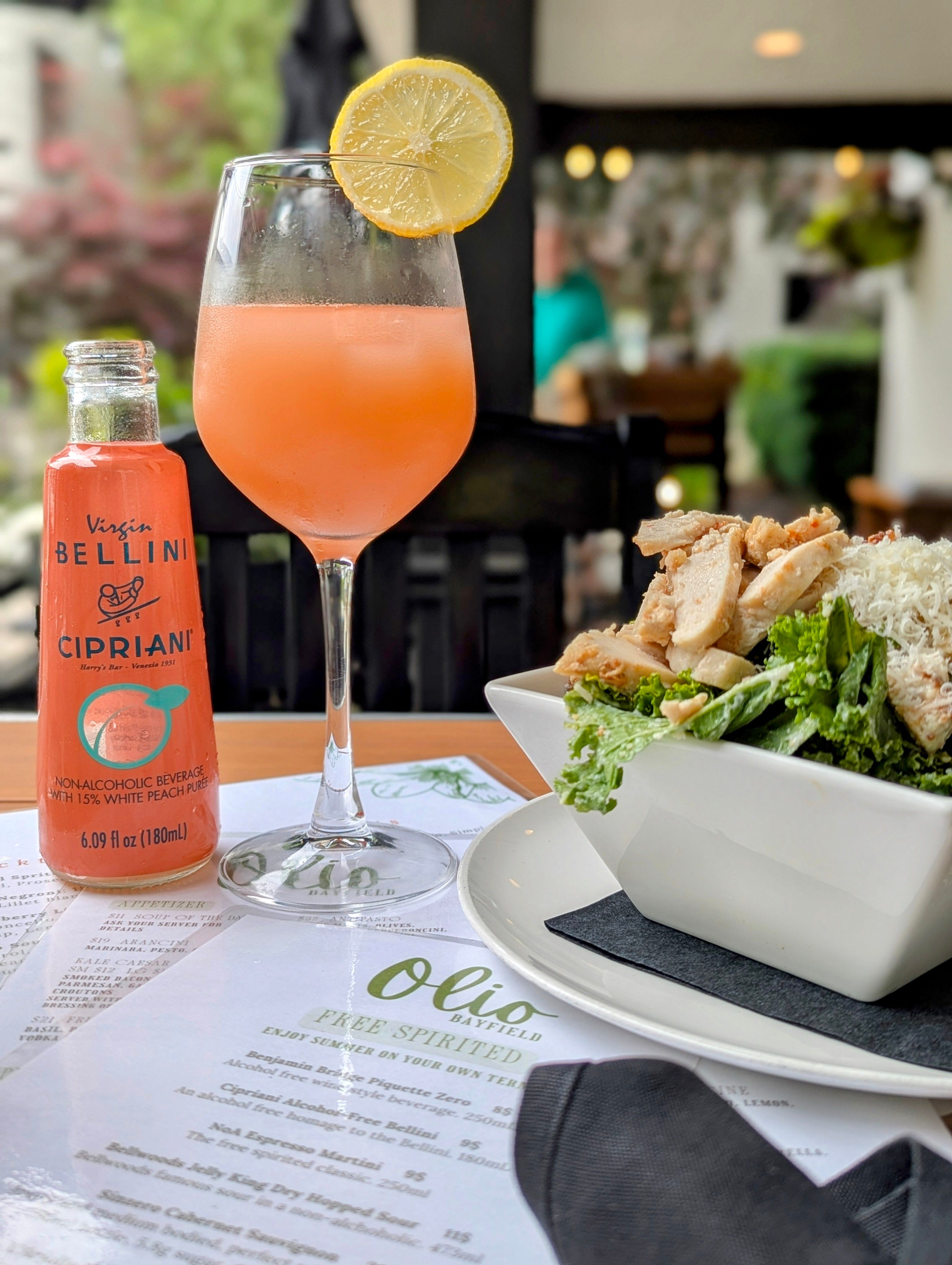 Bellini cocktail and courtyard dining at Olio