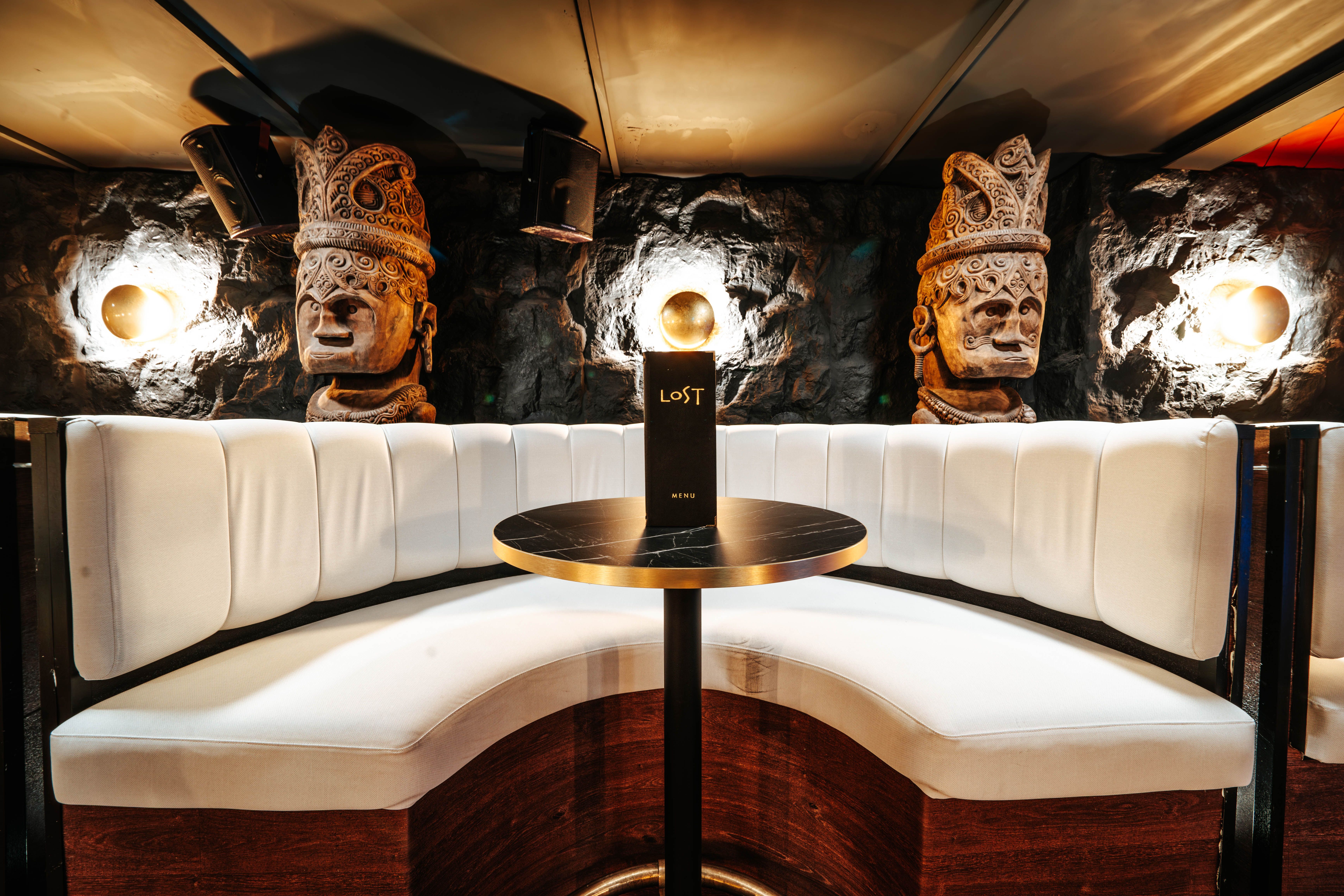 Carved stone statues and VIP booth at LOST Bournemouth