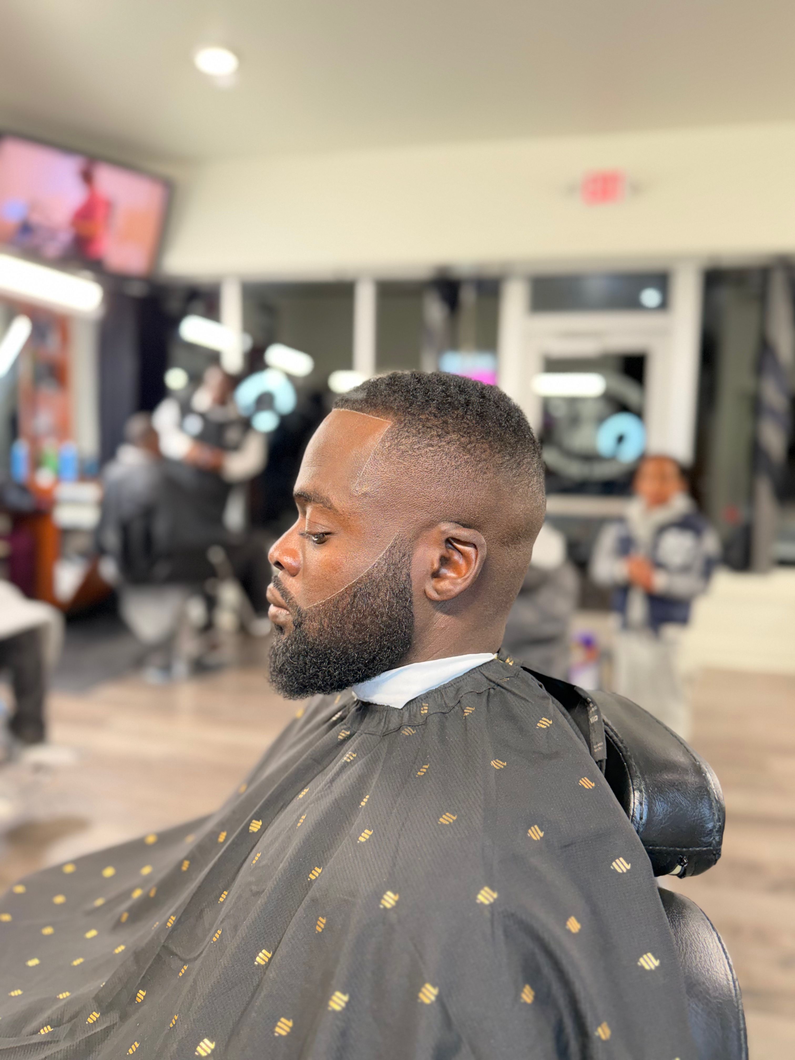 Fresh fade haircut with groomed beard trim Rochester barber