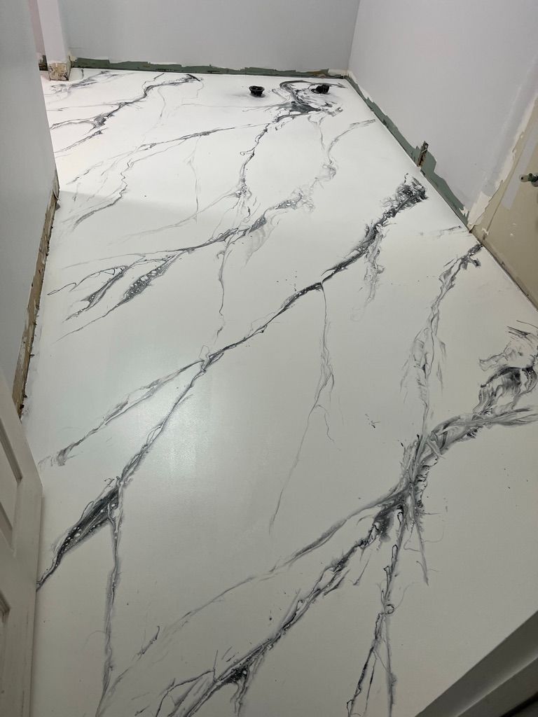 Residential room with white marble-effect epoxy floor