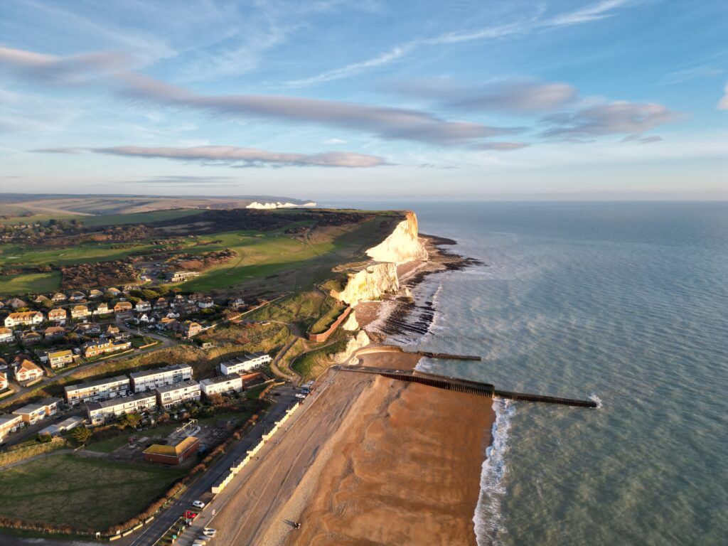 Aerial drone photography of Seaford coastline and Seven Sisters chalk cliffs in East Sussex — professional property photographer