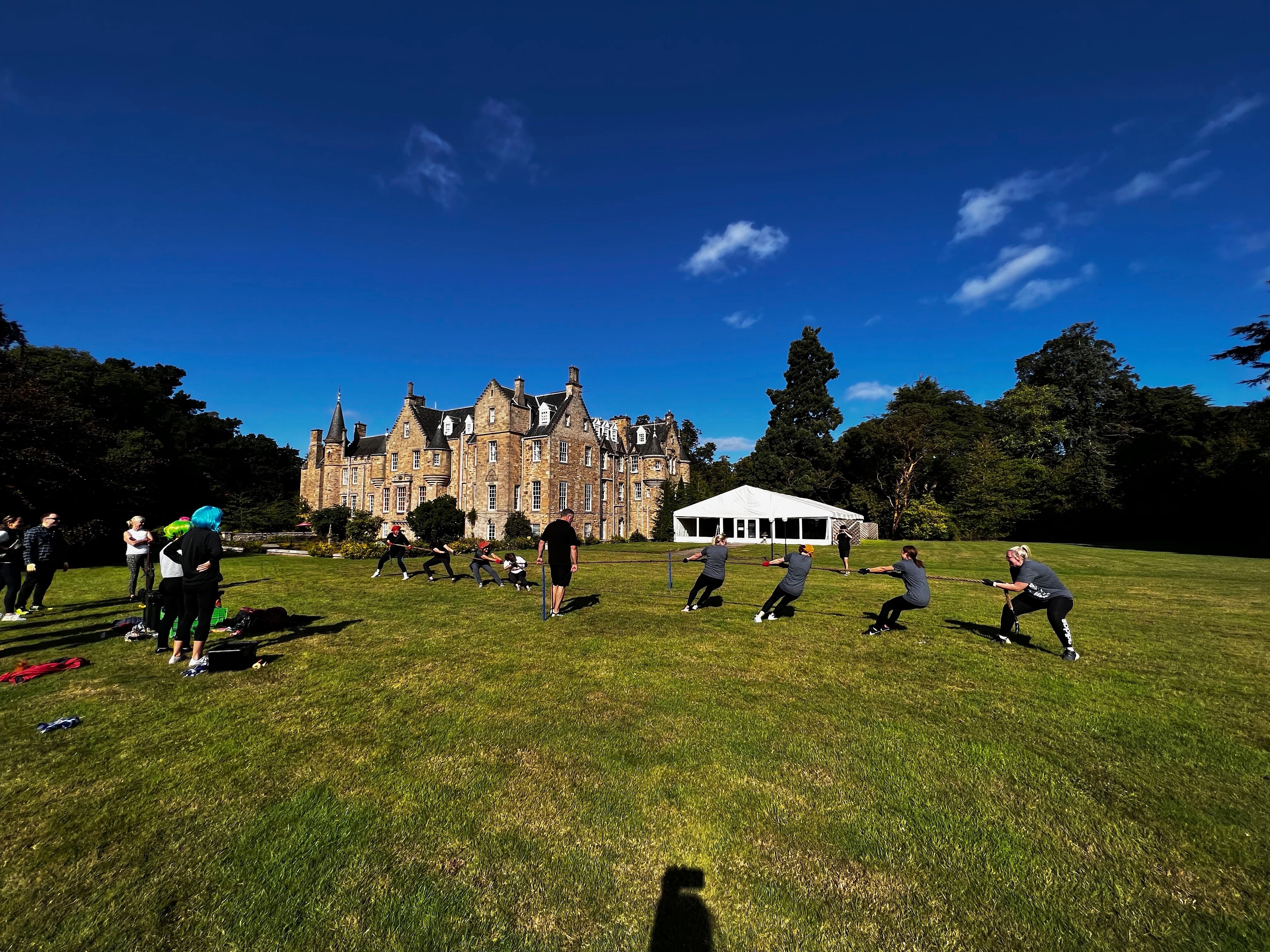 Carberry Tower castle hotel East Lothian — groups enjoying outdoor activities on the castle grounds