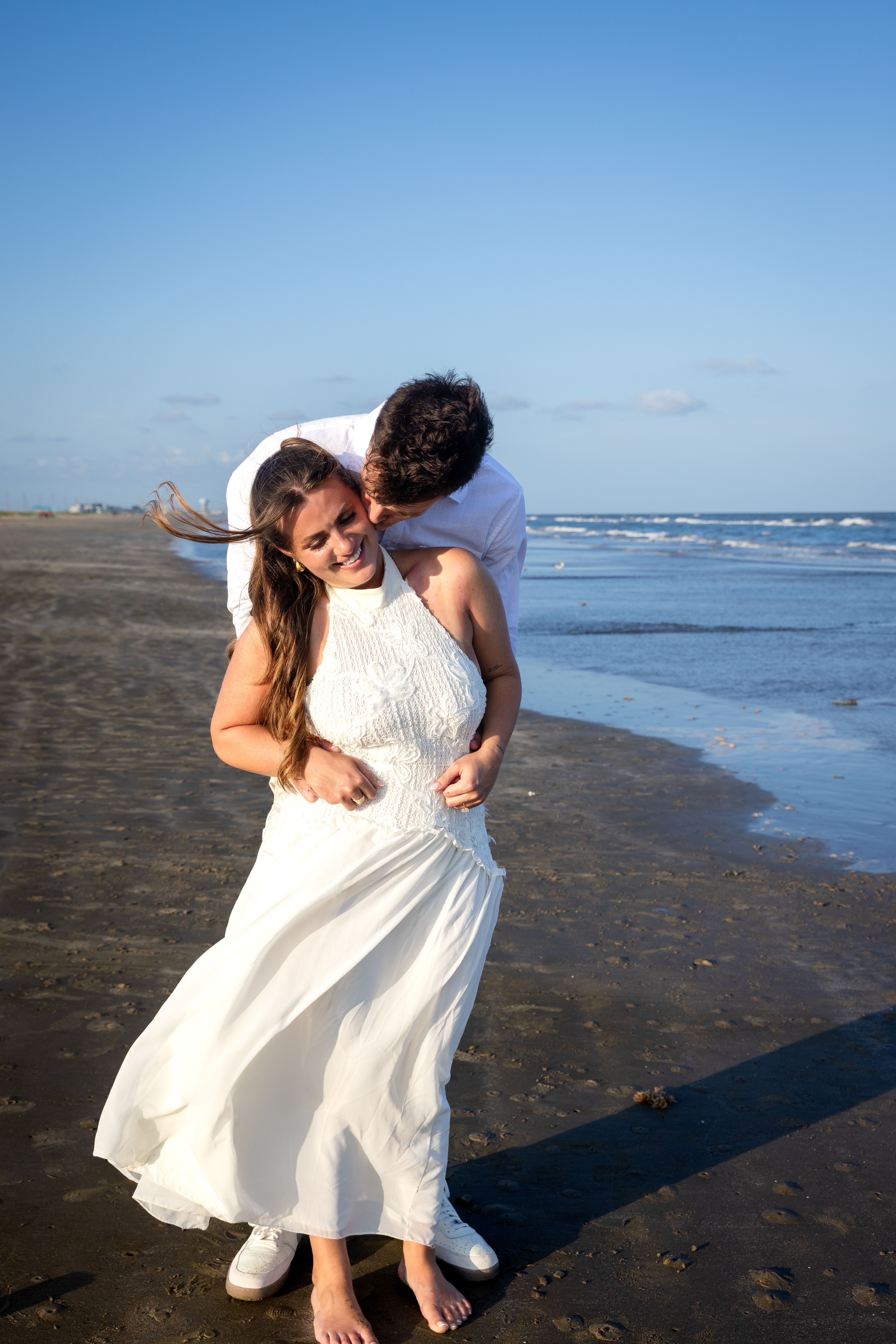 Man kissing woman on the cheek — couples portrait