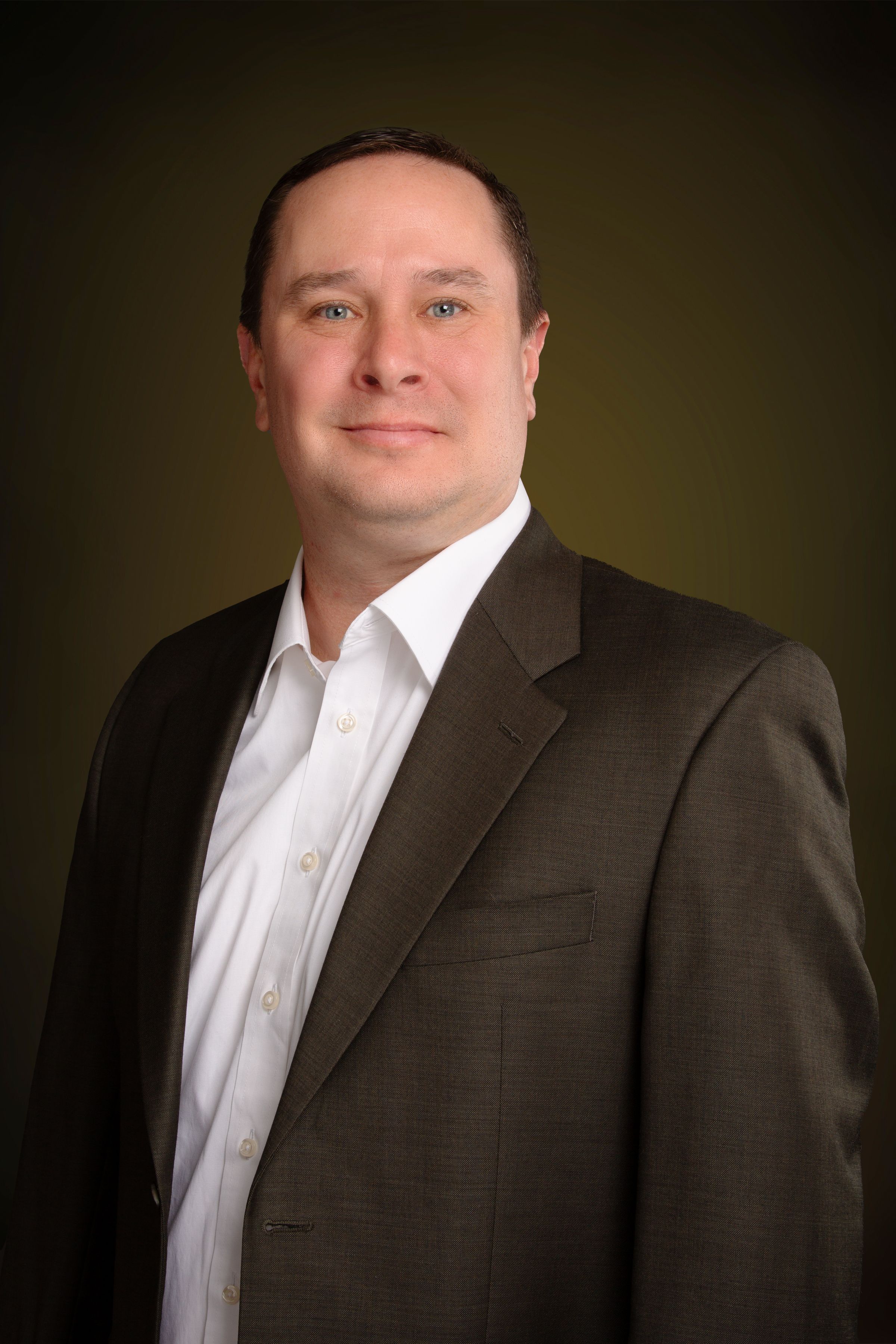 Professional headshot - man in brown suit