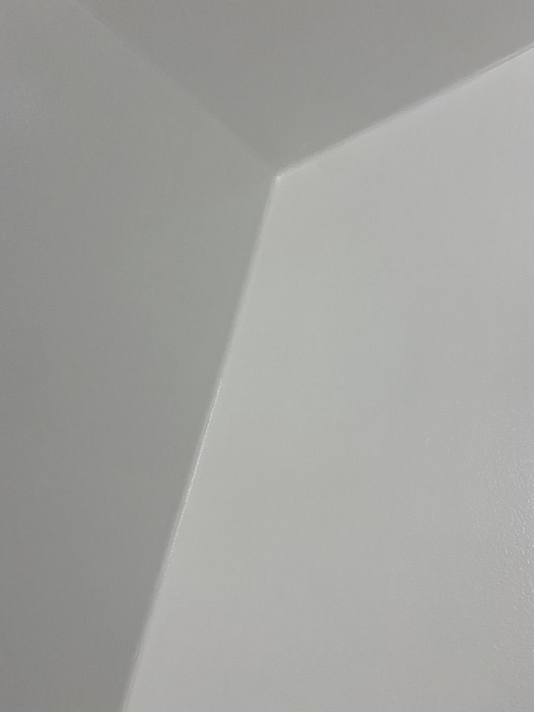Seamless white epoxy wall and ceiling cove junction in a manufacturing clean room