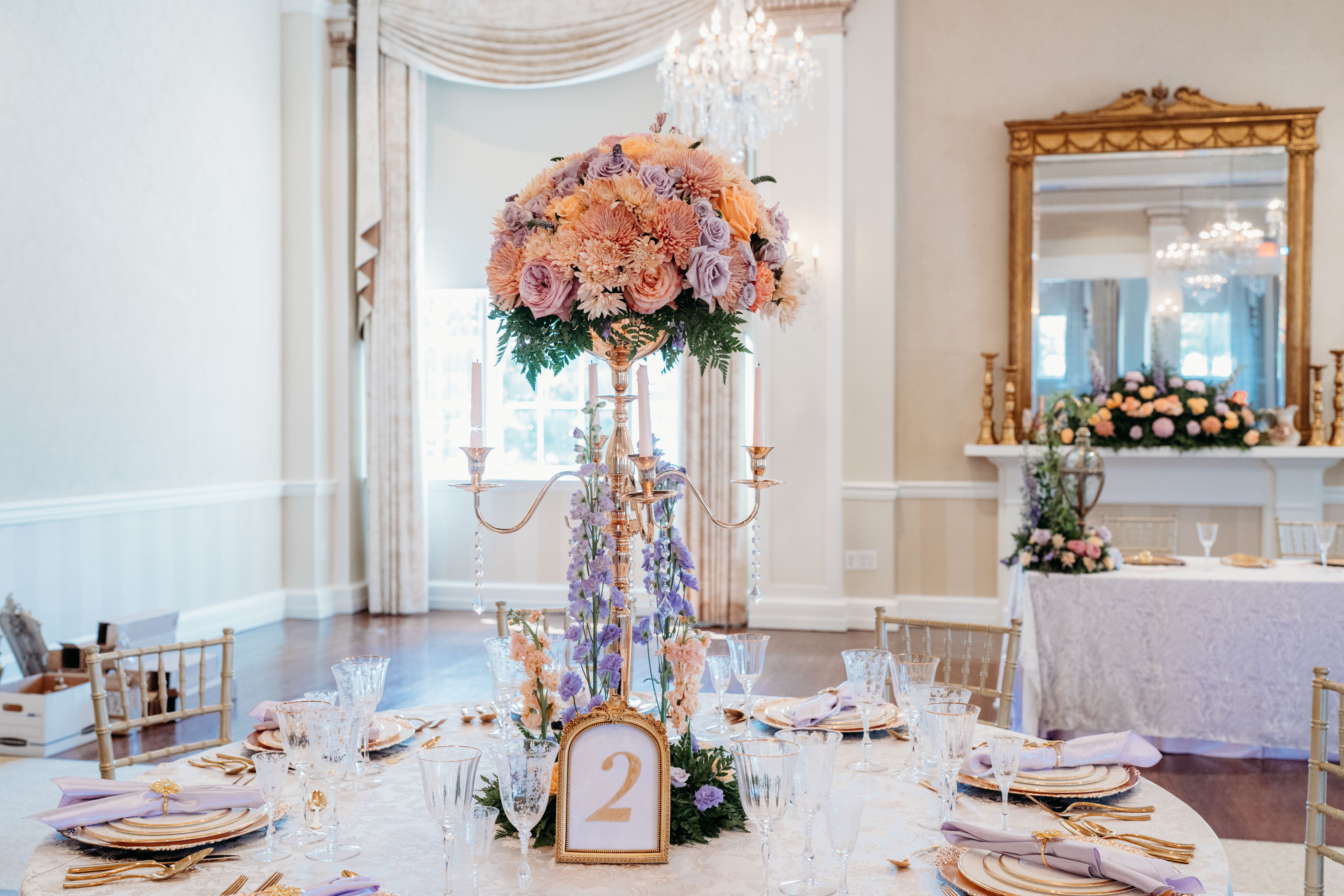 Elegant reception tablescape with gold candelabras and pastel florals at the George Washington Hotel