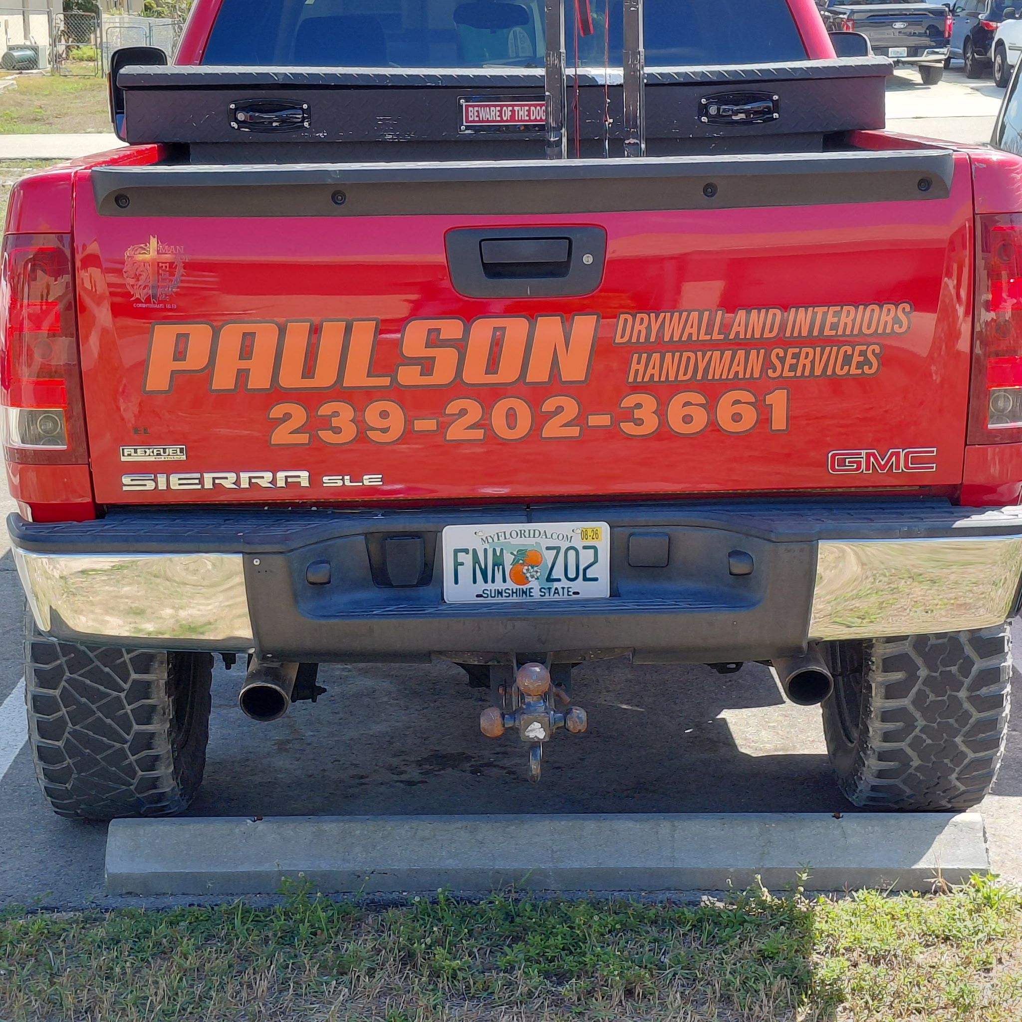 Paulson Drywall And Interiors branded work truck