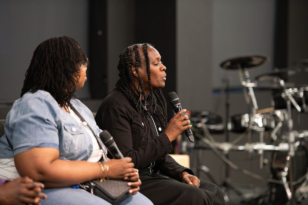 Two speakers in podcast interview setting