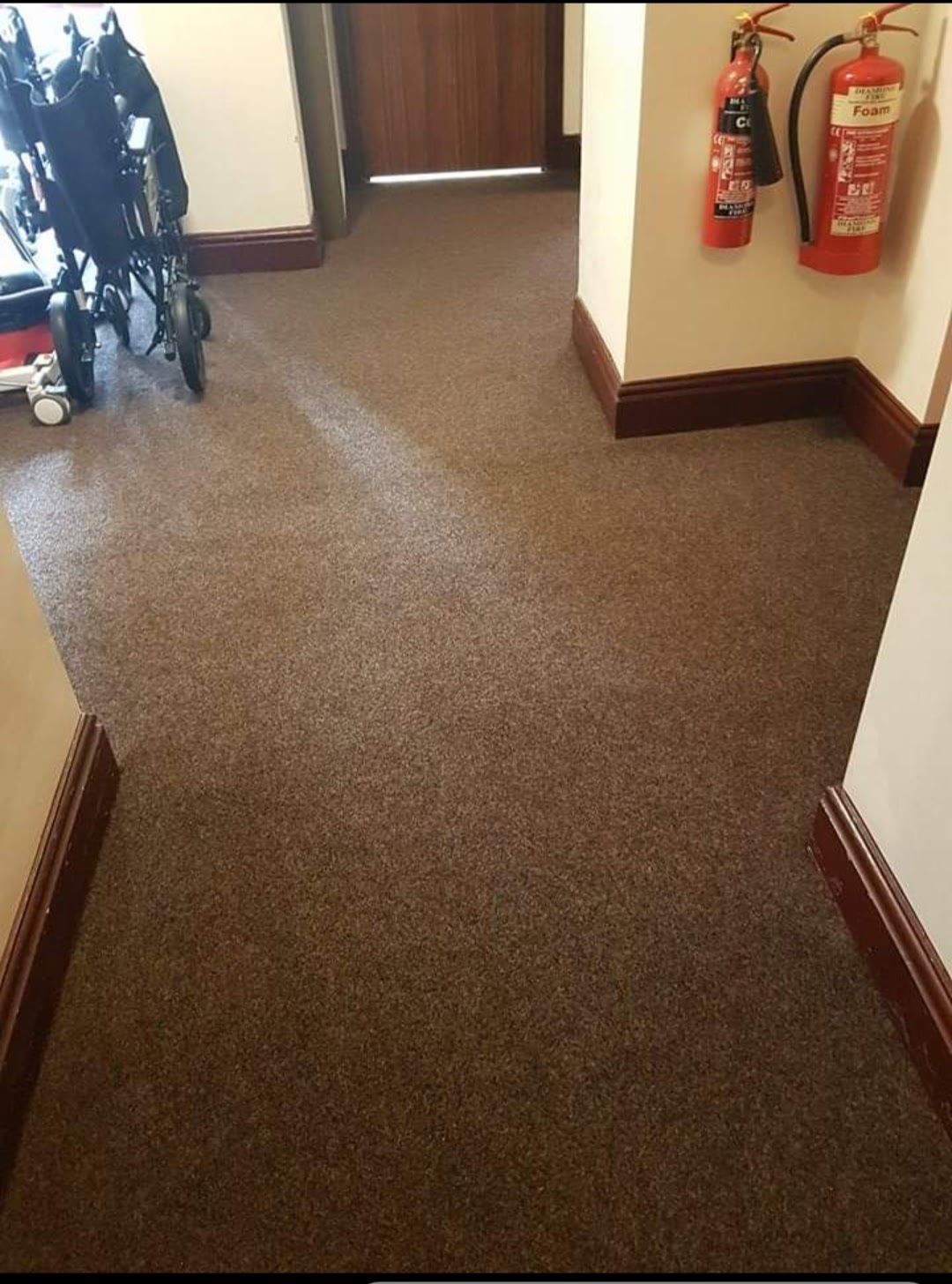Commercial corridor with carpet fitted for heavy foot traffic