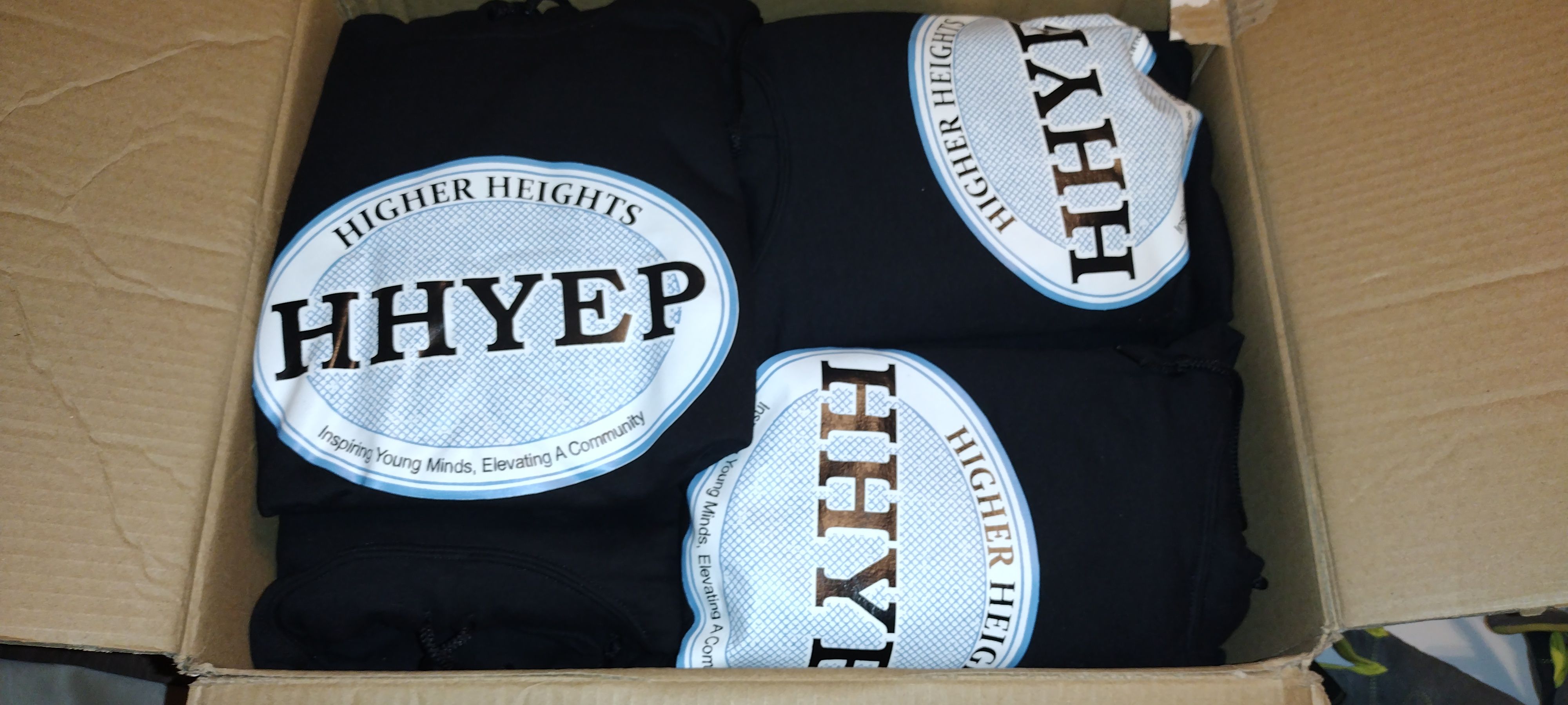 Higher Heights custom hoodies in box