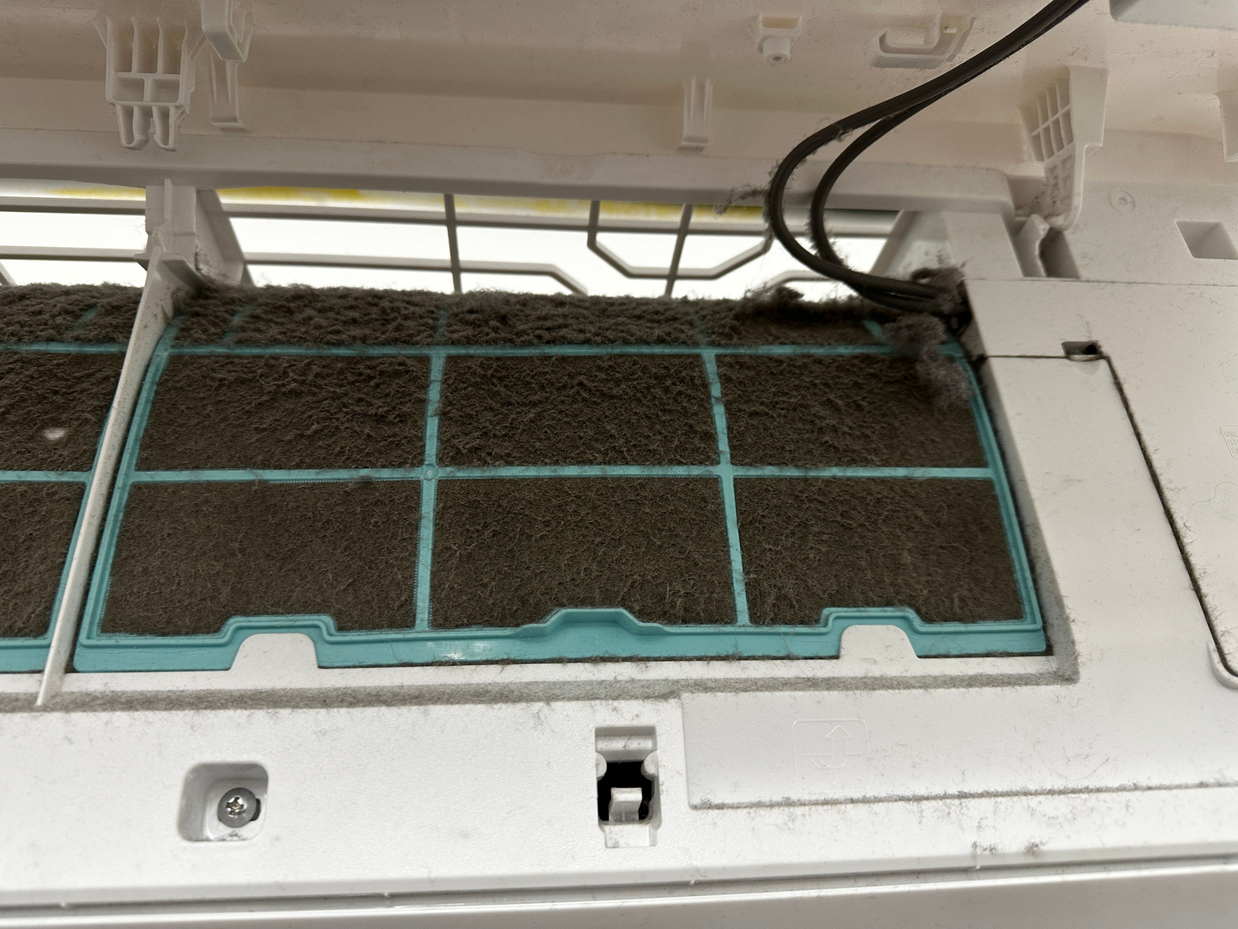 AC unit filter showing need for regular maintenance