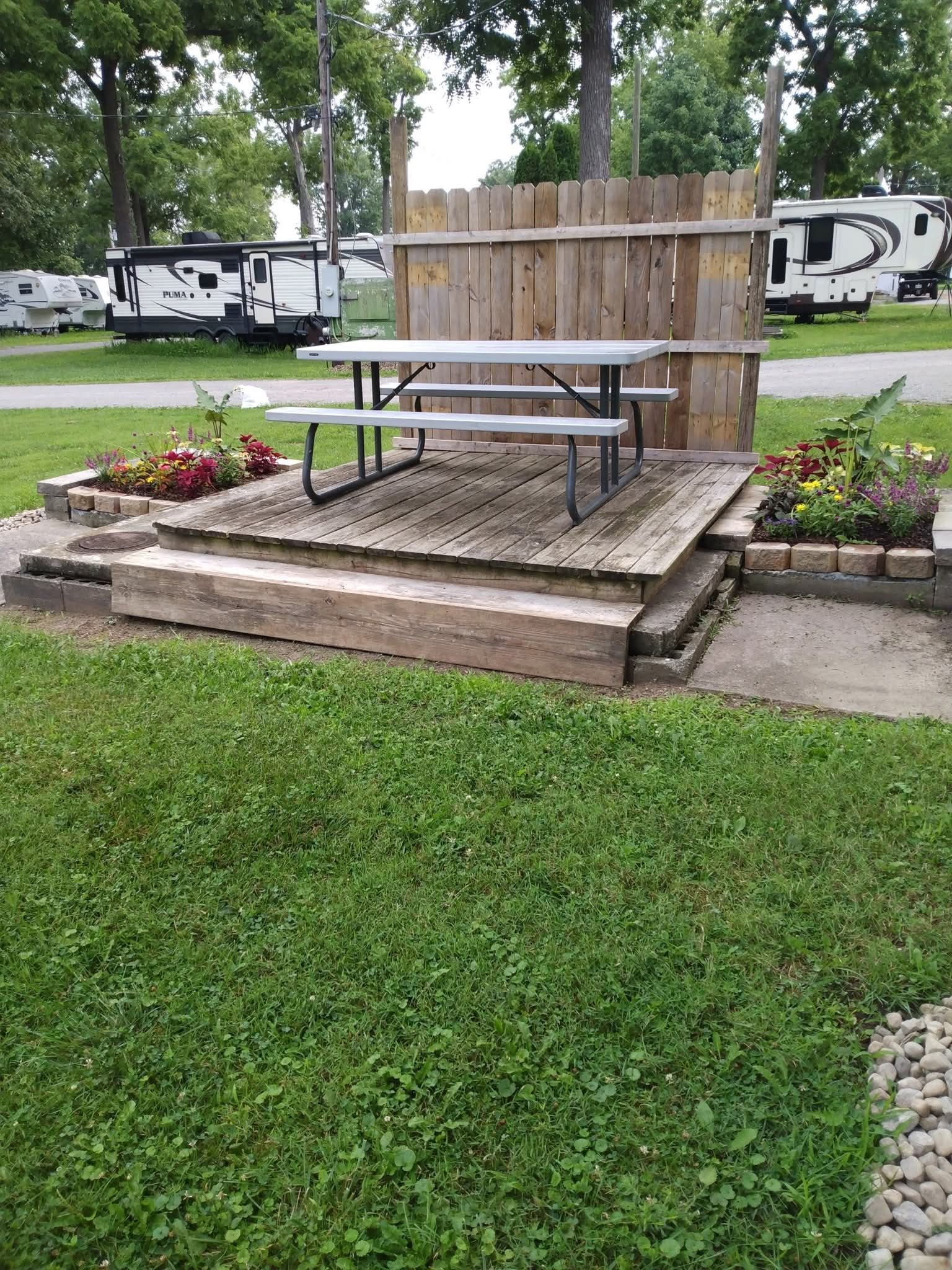 Picnic table platform with flower beds at Welcome Woods campground