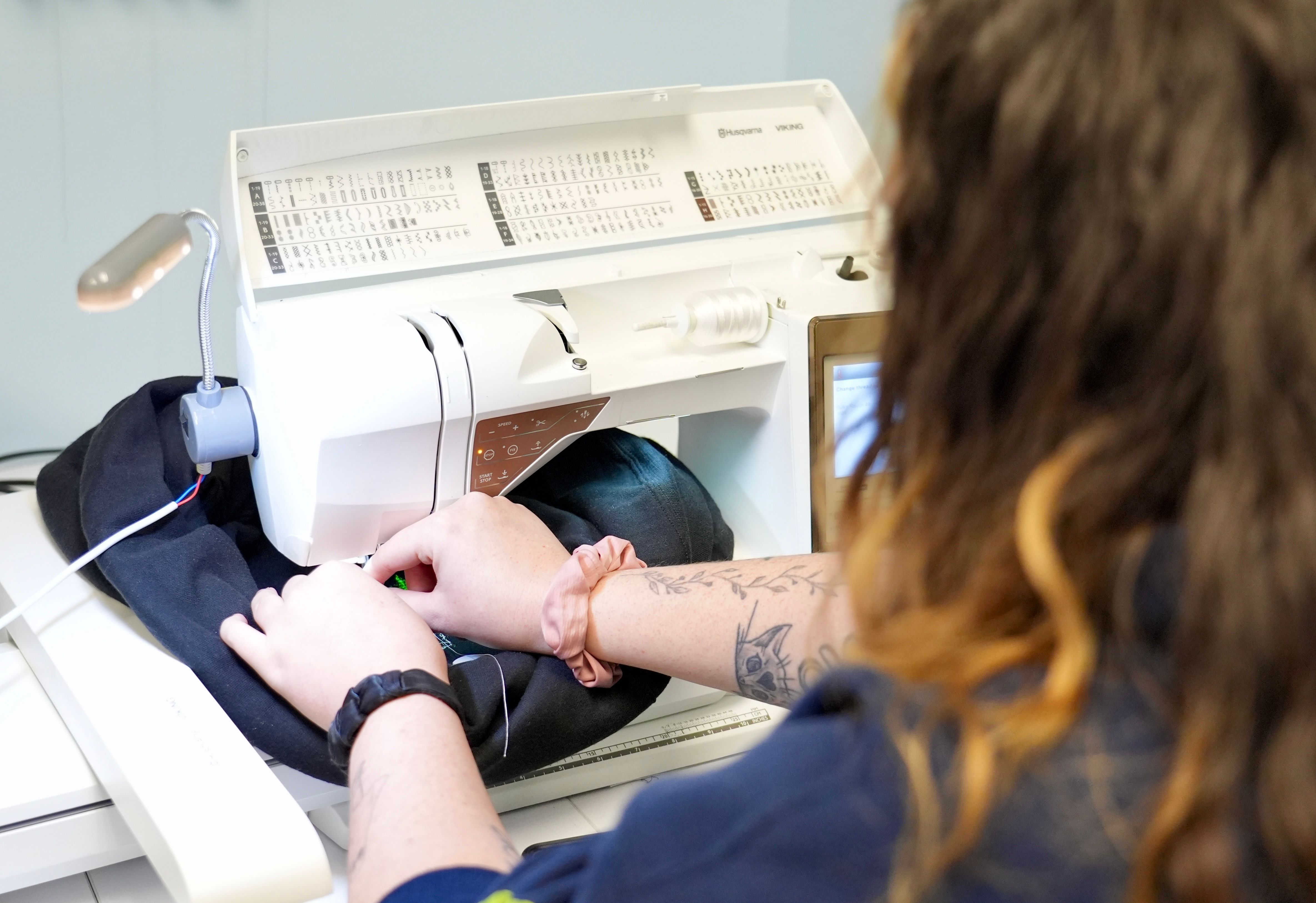 Expert seamstress working on a garment at the sewing machine