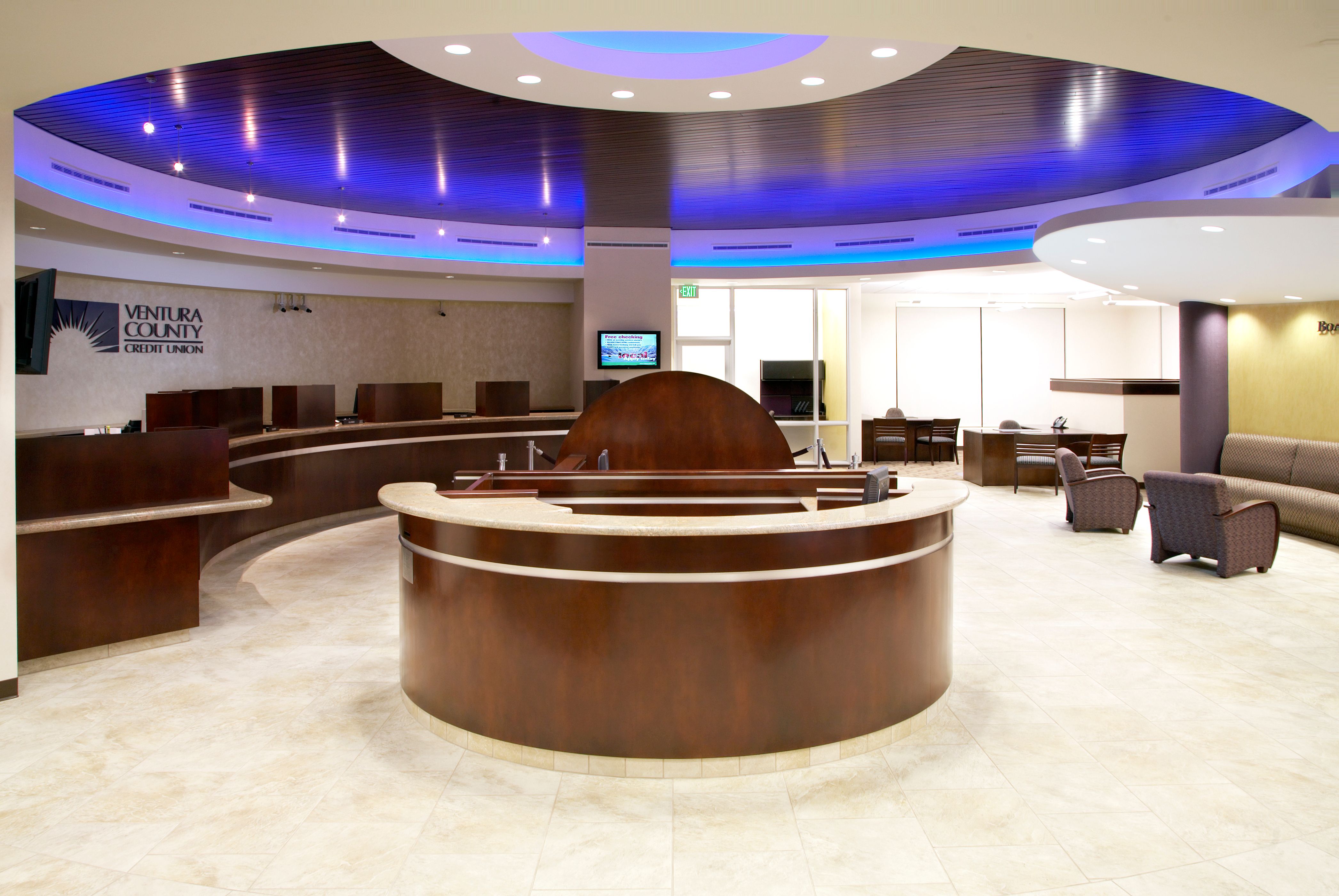 Custom curved reception desk and millwork for Ventura County Credit Union by California Woodworking