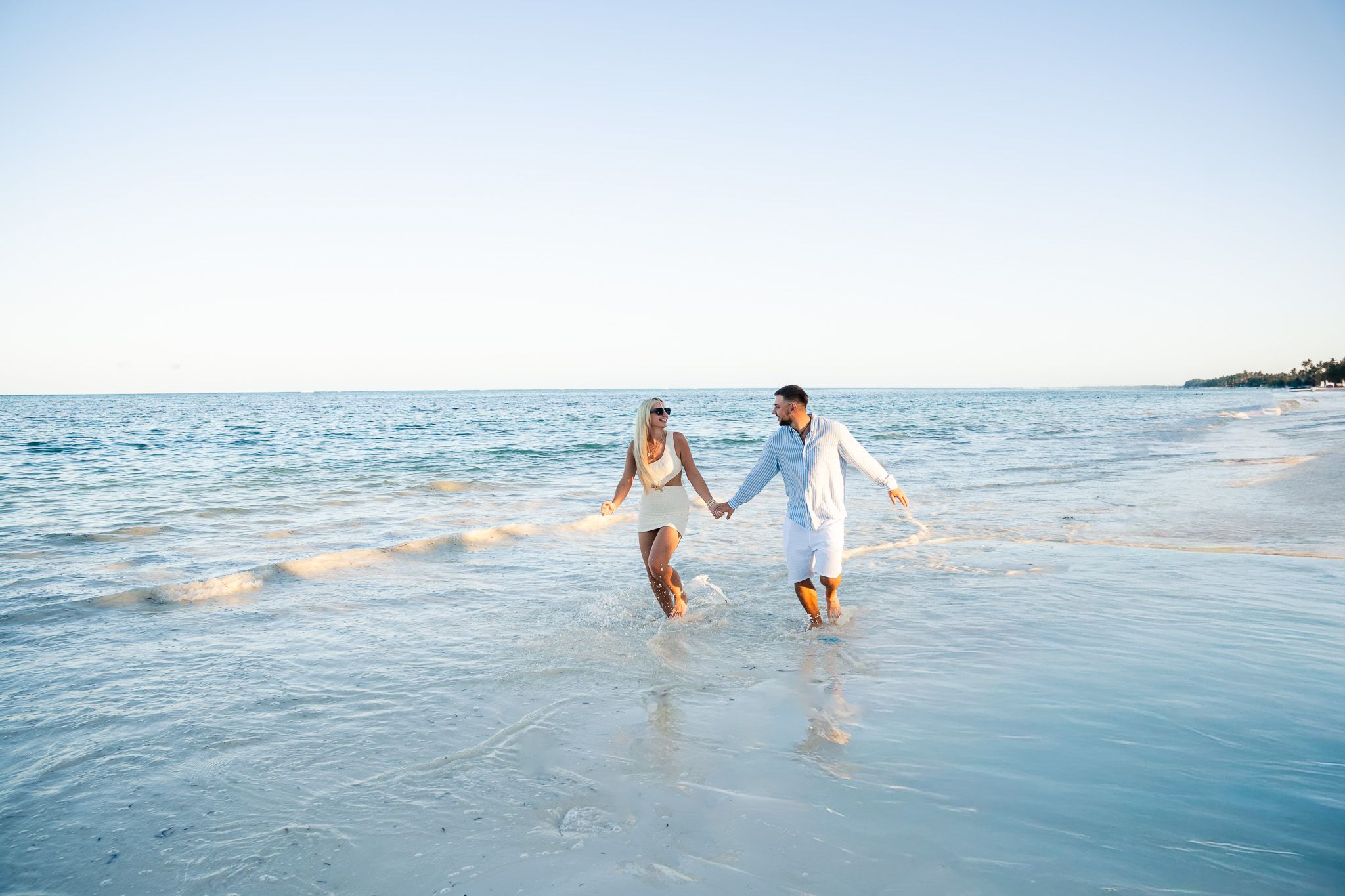 Couple walking on Zanzibar beach
