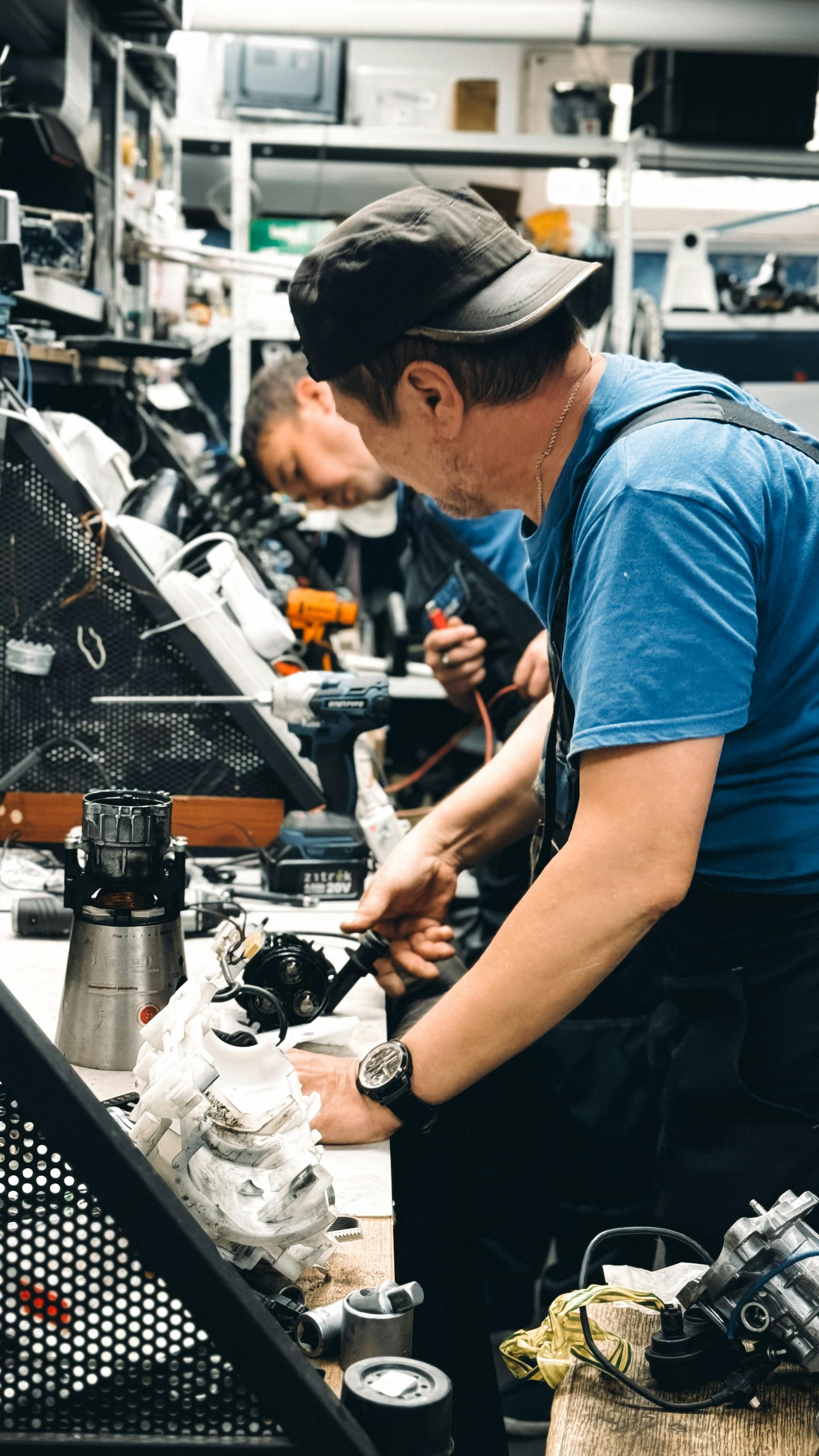 Experienced mechanics performing vehicle repairs at Big B AutoWorks