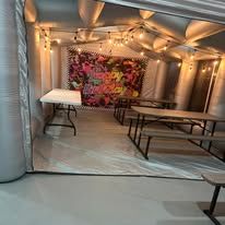 Party seating area with tables and lights