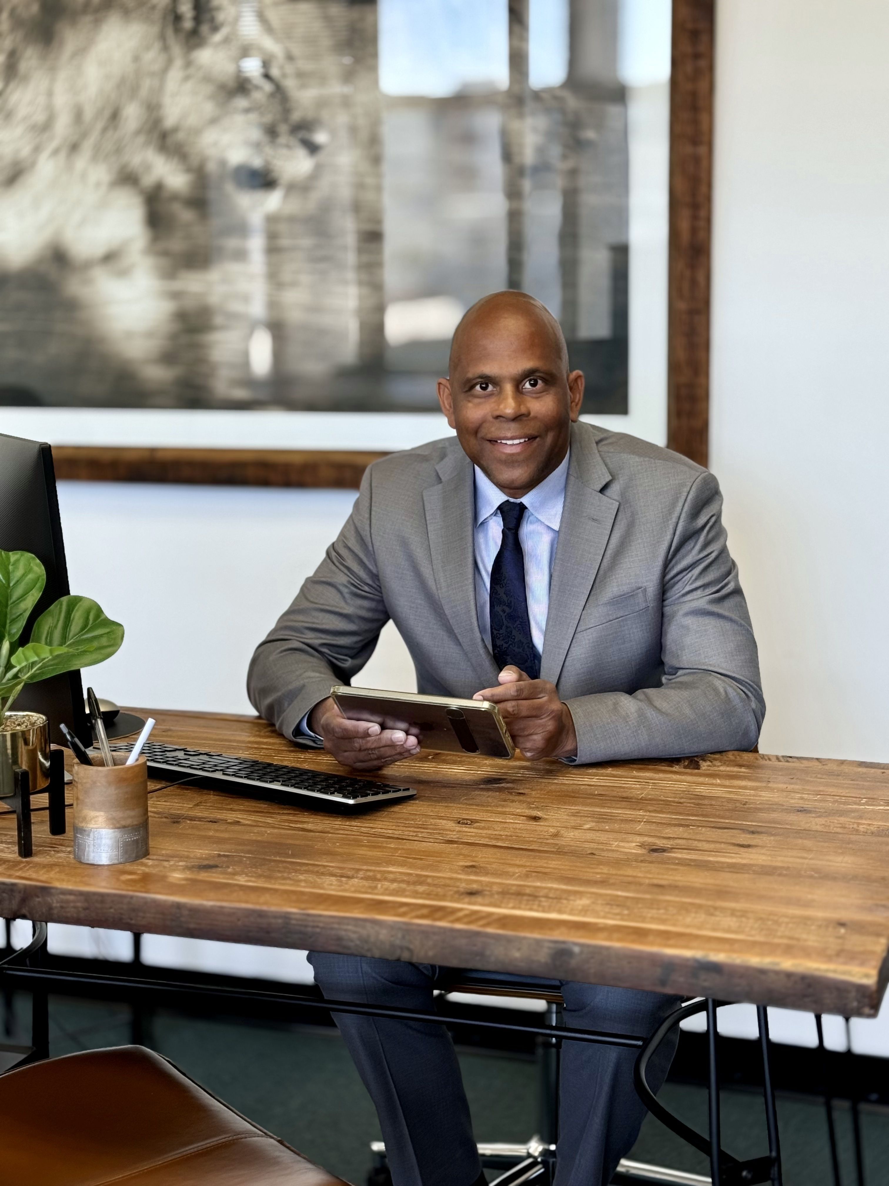 Terry Lewis listing specialist headshot at desk
