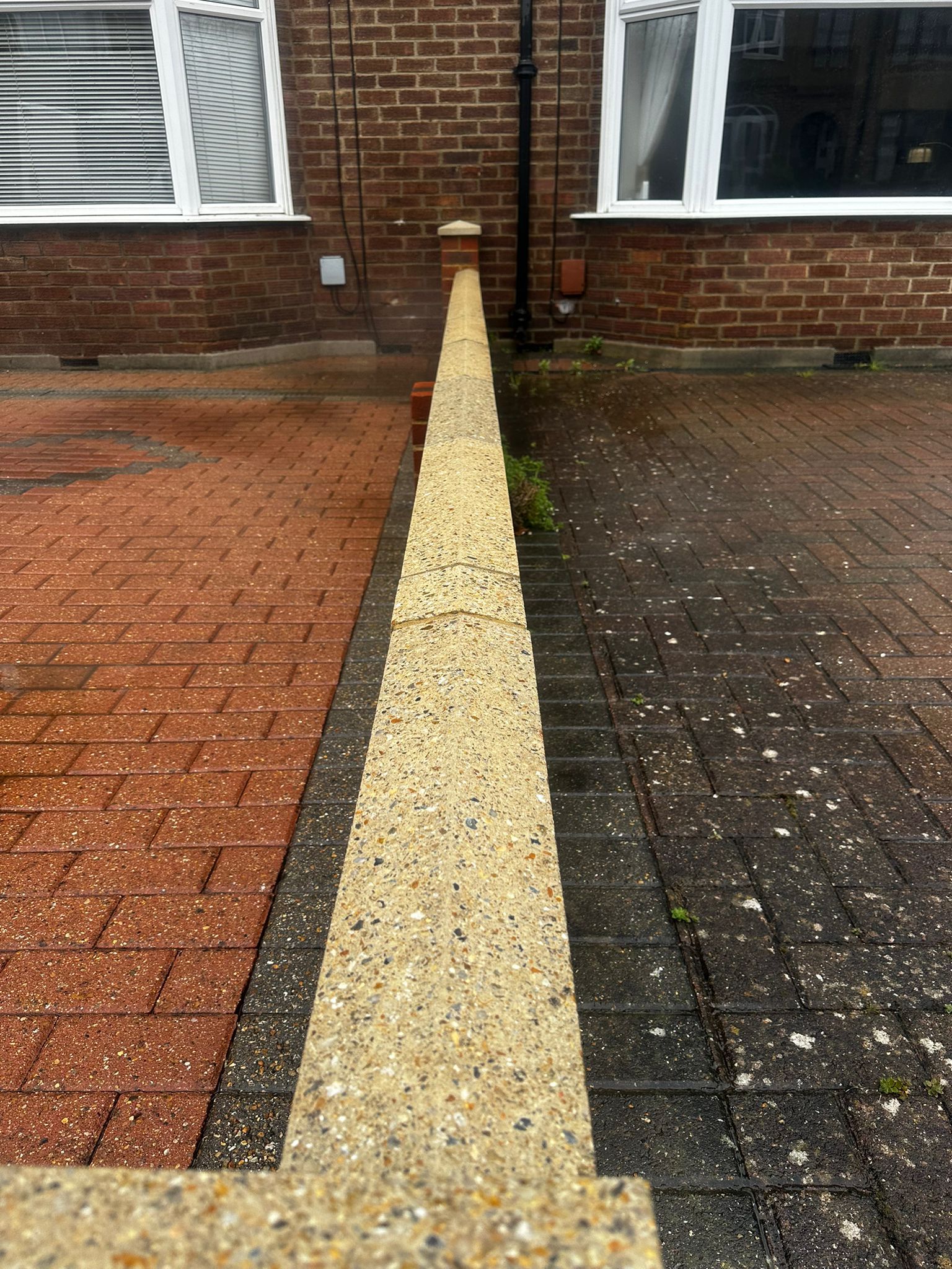 Side by side comparison of cleaned and uncleaned driveways