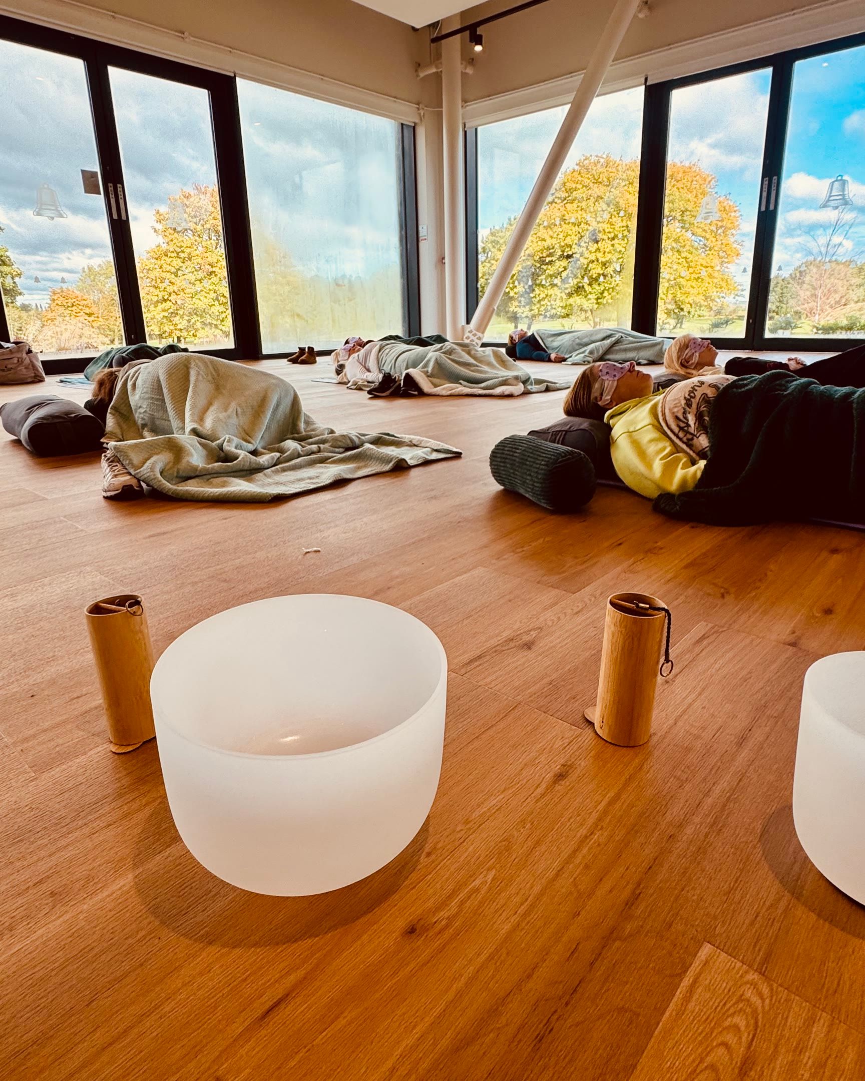 A calm group session with bowls and autumn trees at The Belfry