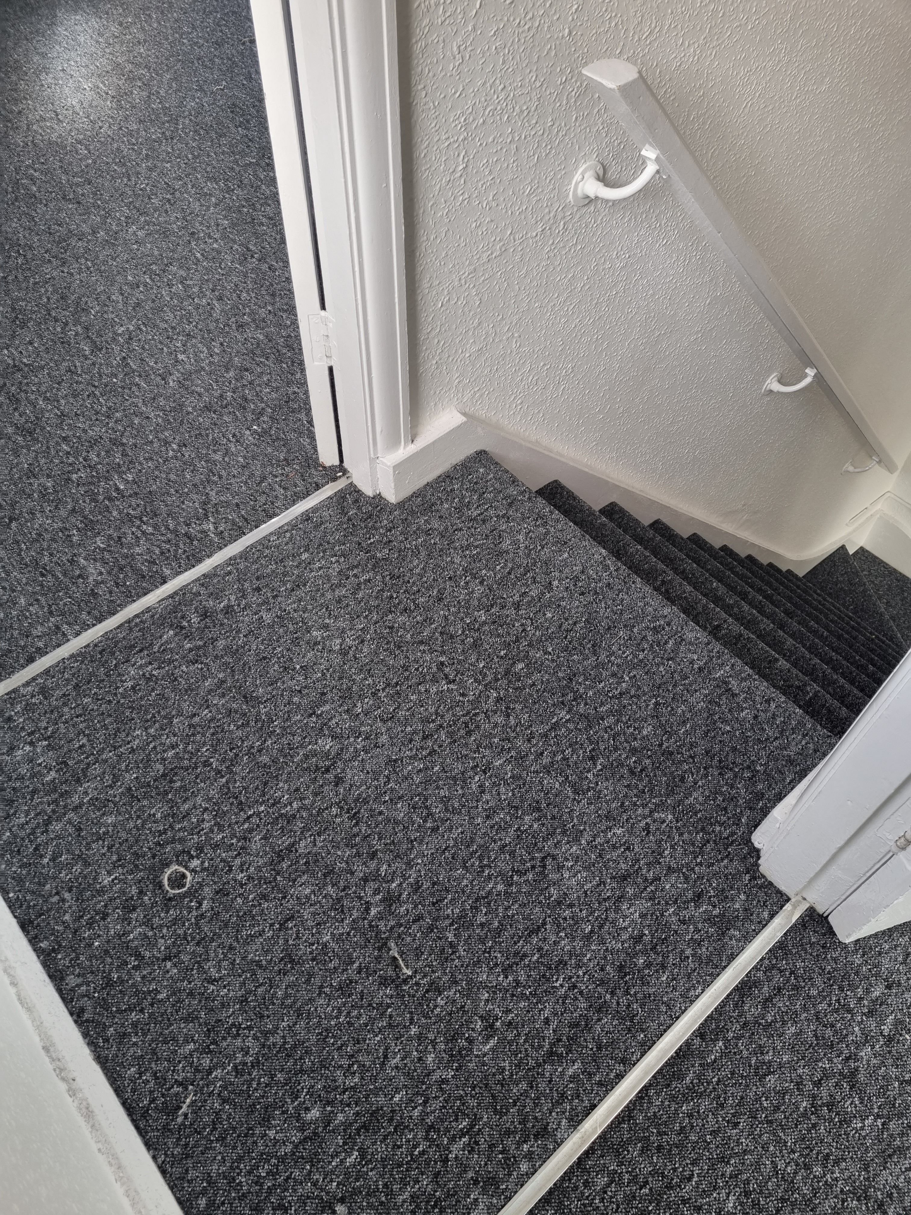 Dark grey carpet fitted on staircase and landing