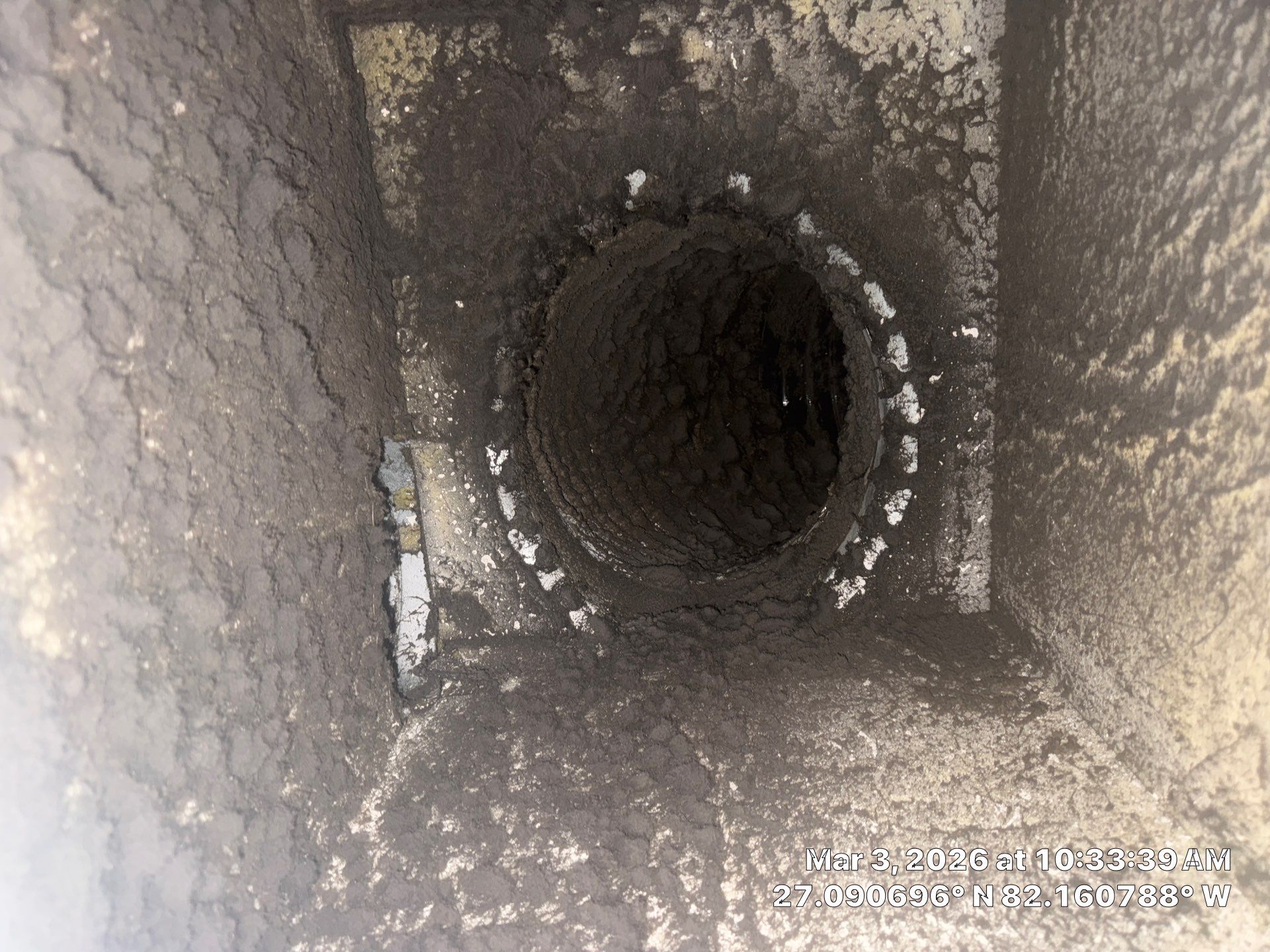 Duct interior showing buildup before cleaning