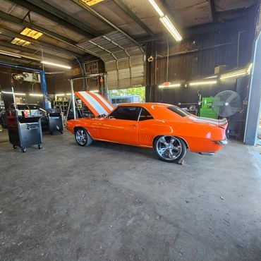 Training inside a working automotive shop