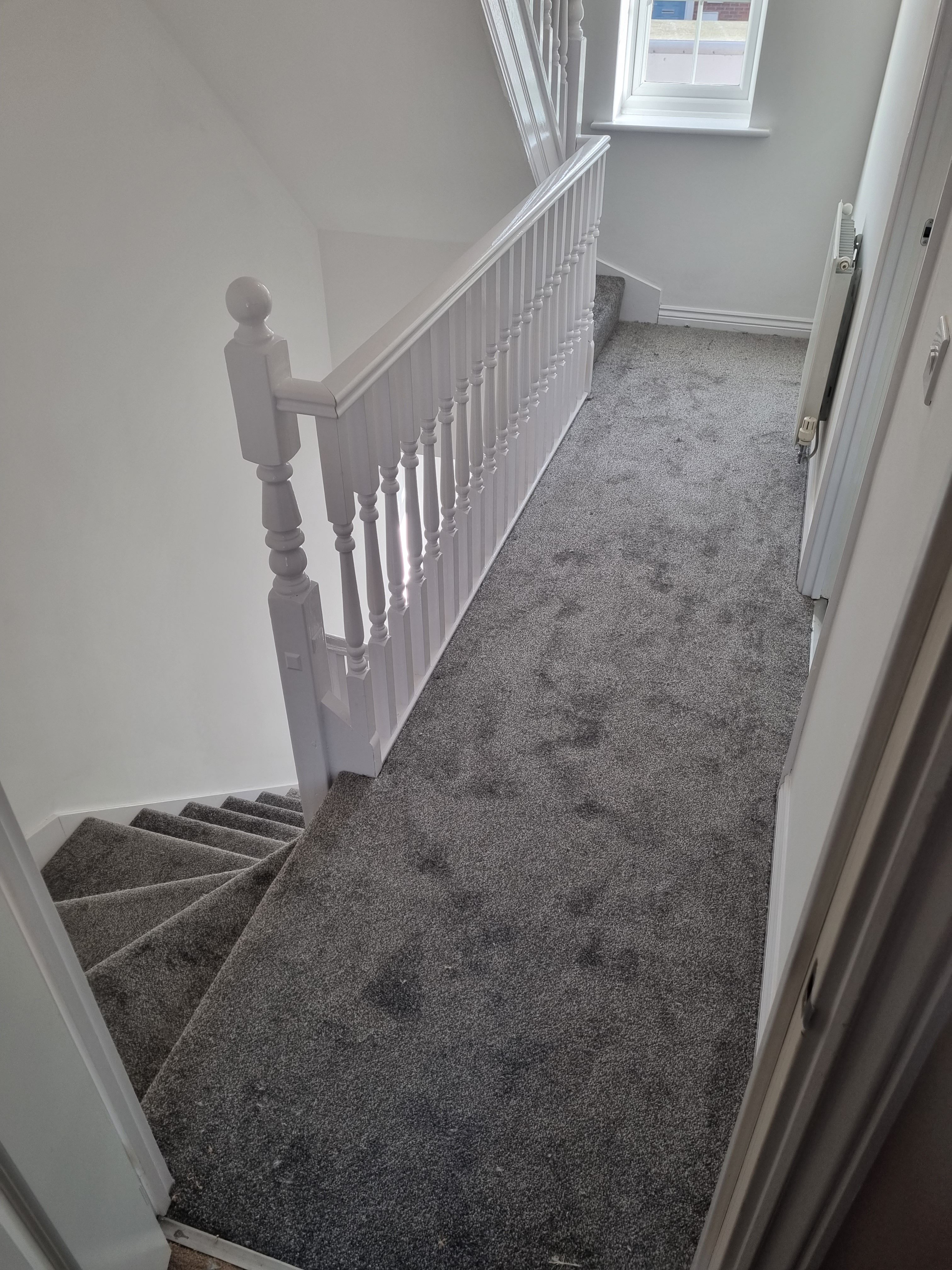 Grey carpet on stairs and landing
