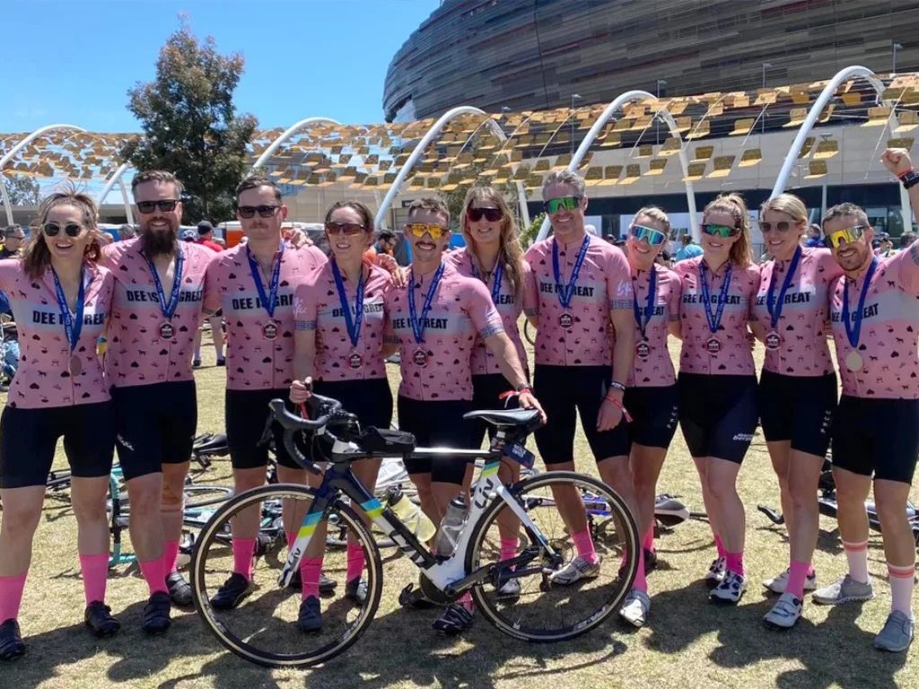 DEE IS GREAT team at the 2022 MACA Cancer 200 Ride wearing pink jerseys