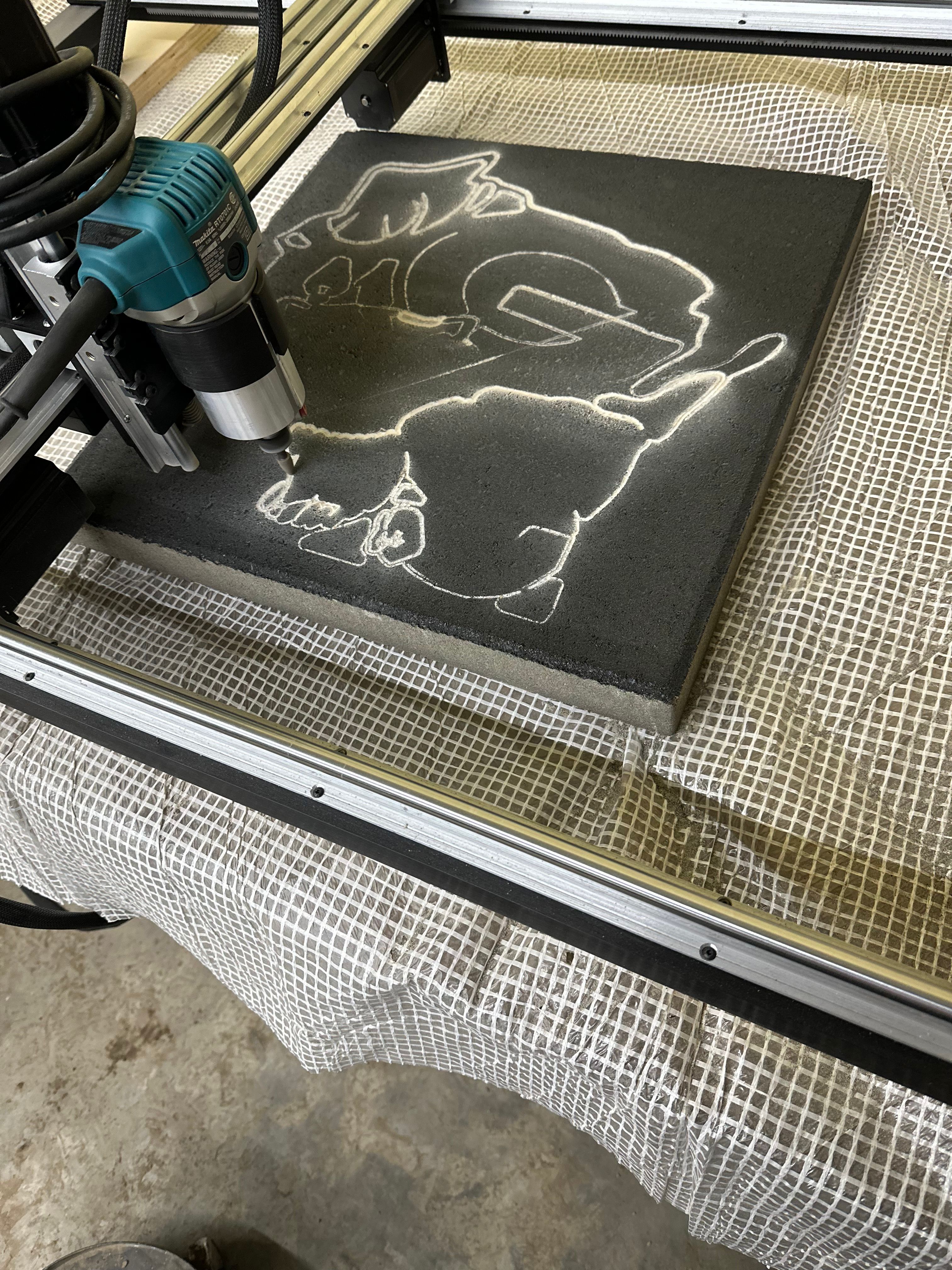 CNC machine mid-engrave action shot