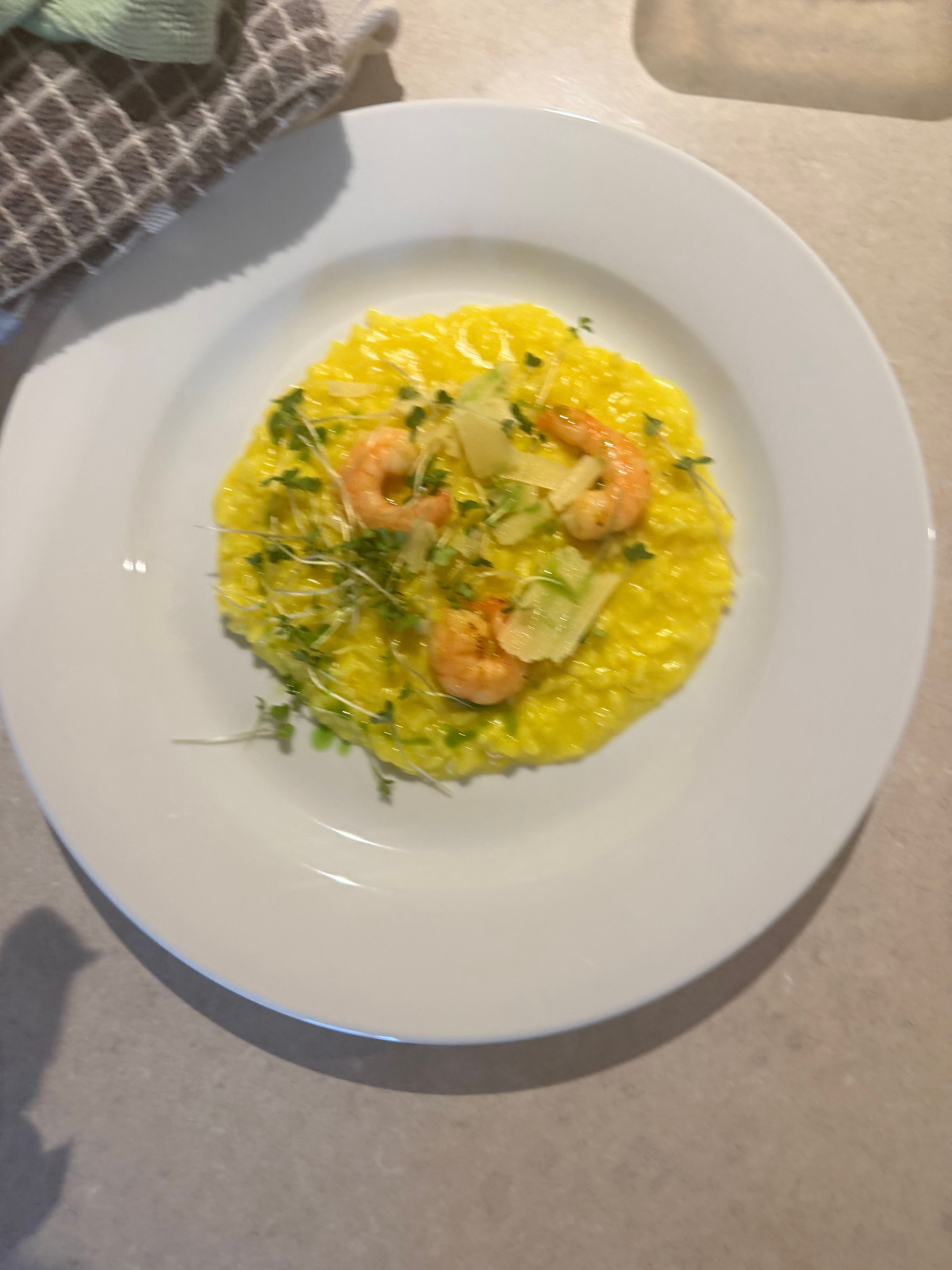 Prawn risotto with microgreens and parmesan shavings