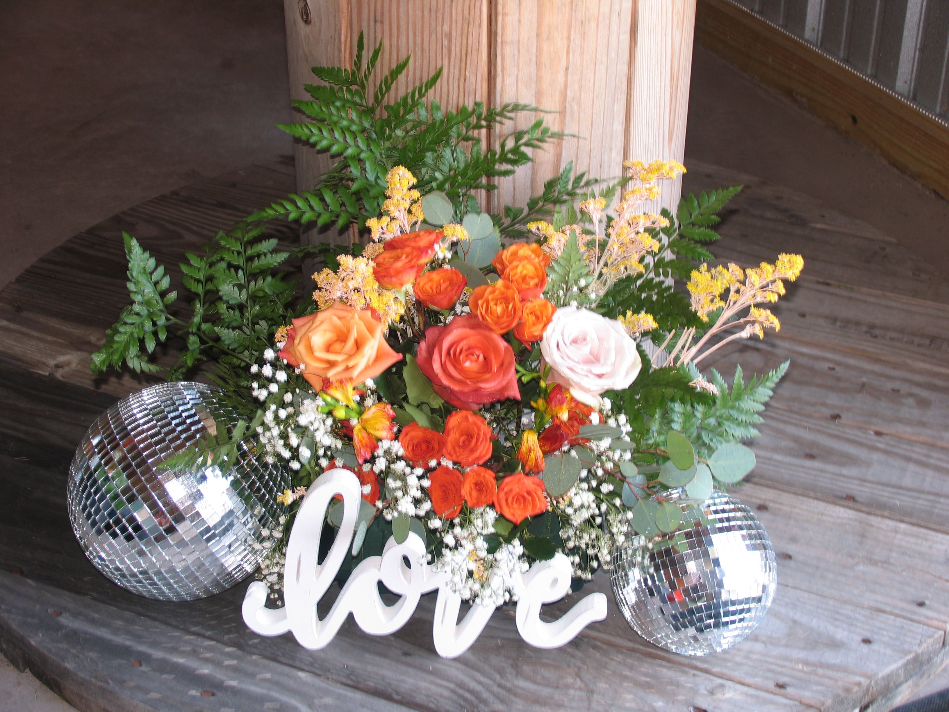 Romantic floral detail with roses, disco balls, and 'love' sign