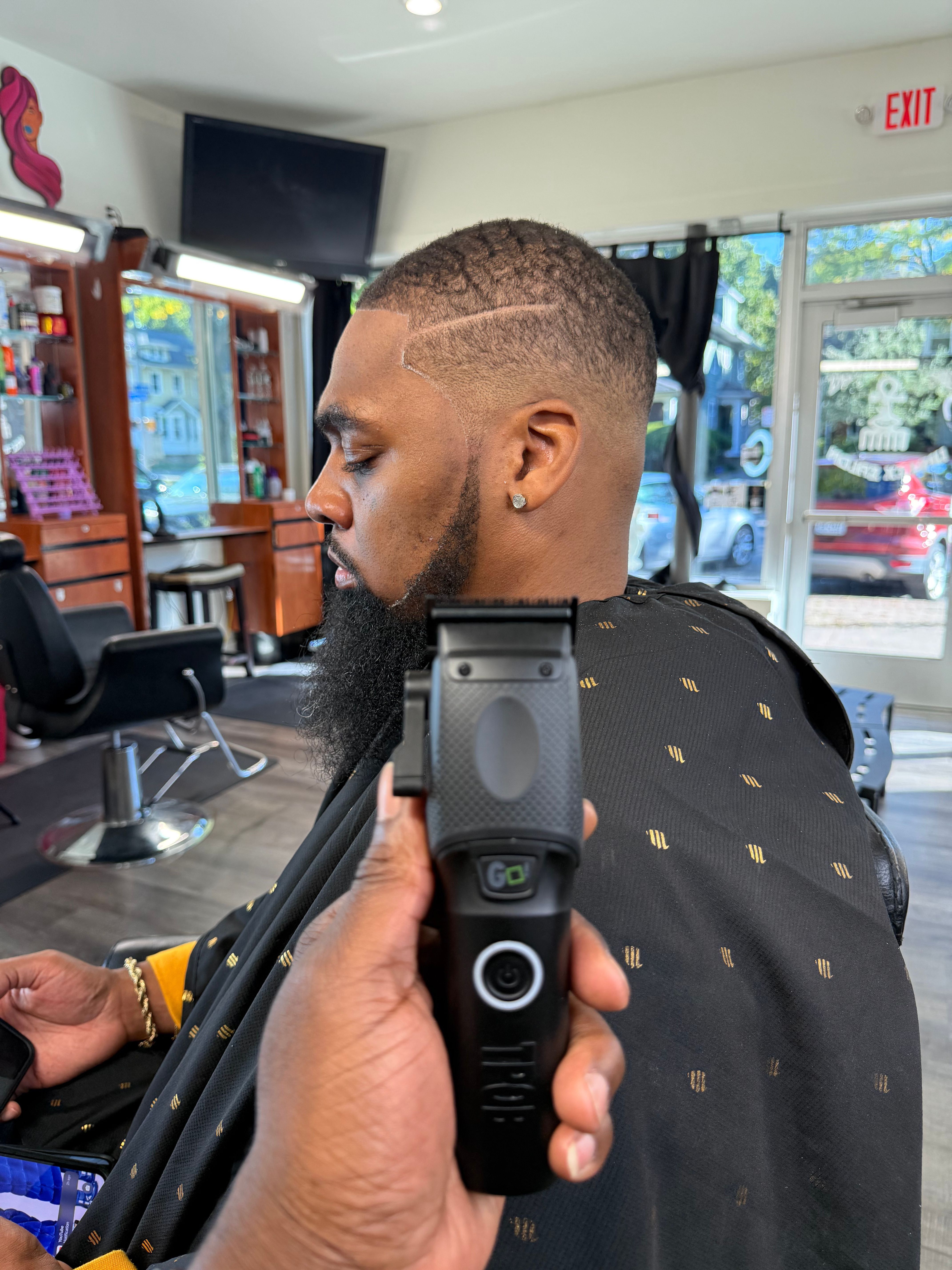 Precision fade with design detail work by master barber RaHa