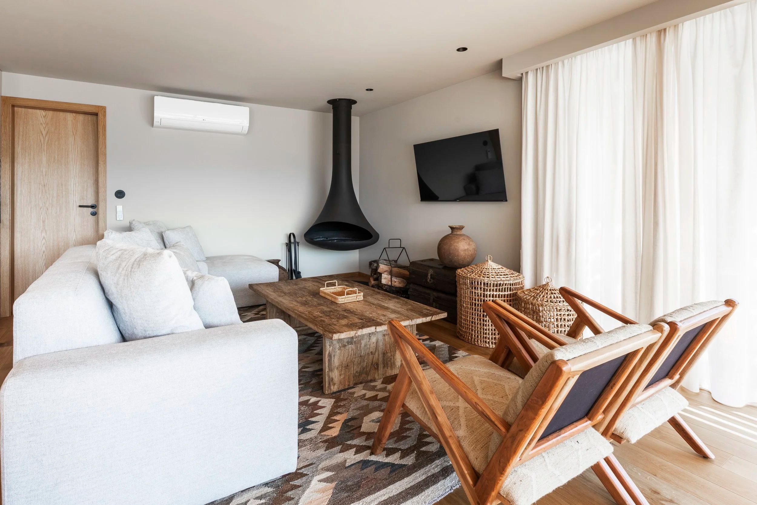 Warm boutique hotel living room with natural light and rustic Portuguese decor — interior photography by Pedro Tavares, Porto