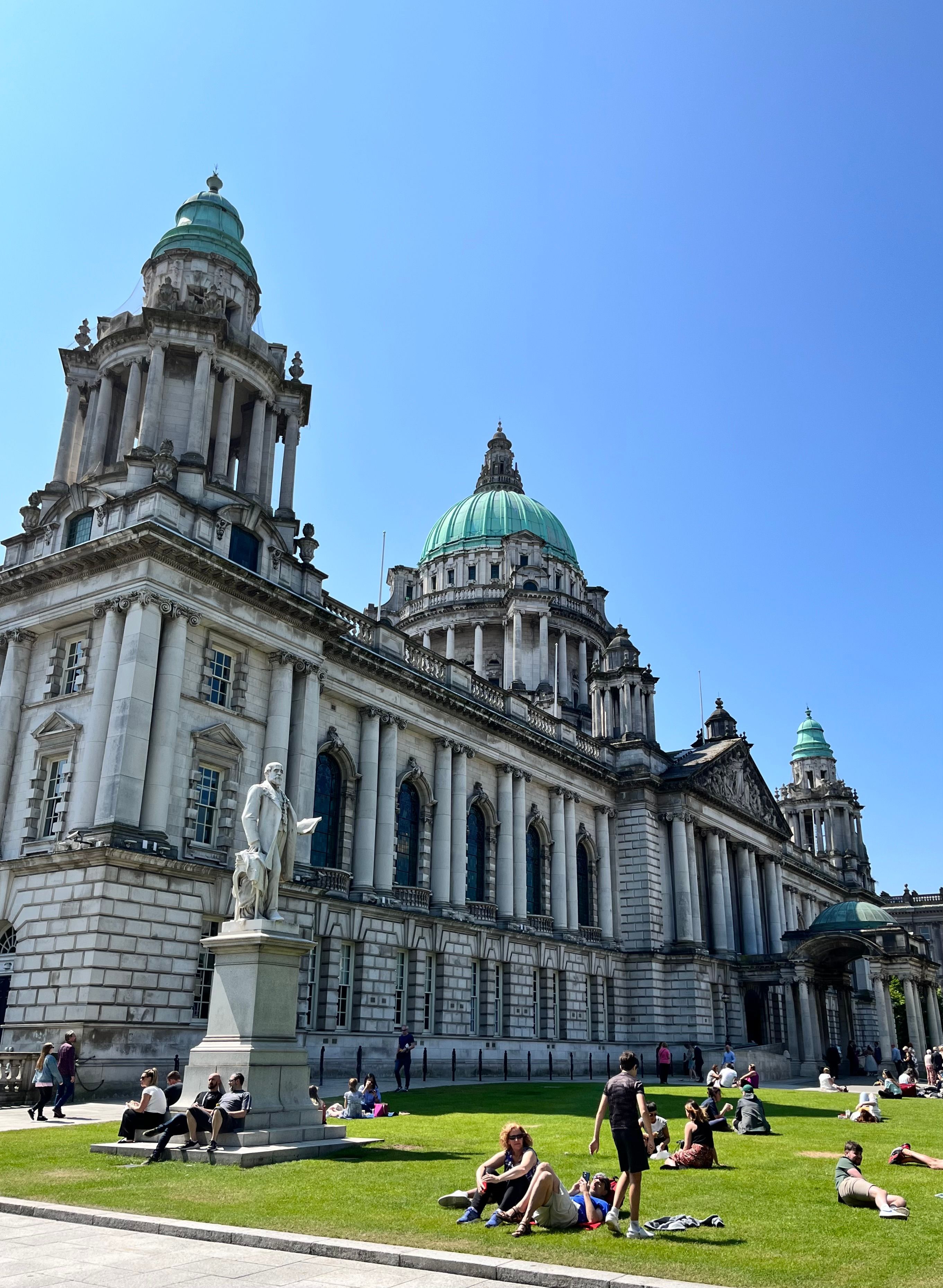 Belfast City Hall with green dome and classical architecture on a sunny day