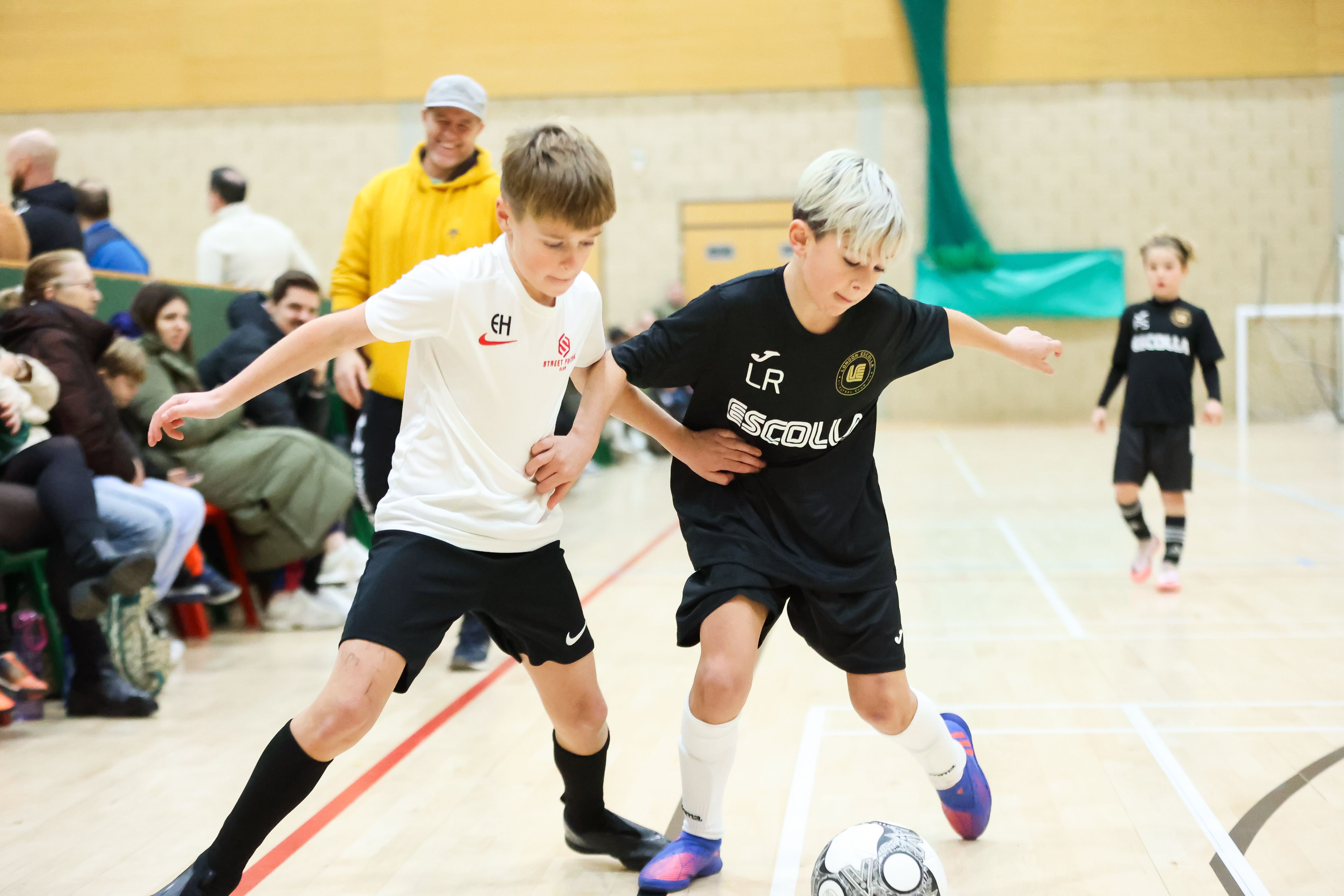 Two young players battling for the ball at Nxt Gen Winter Cup