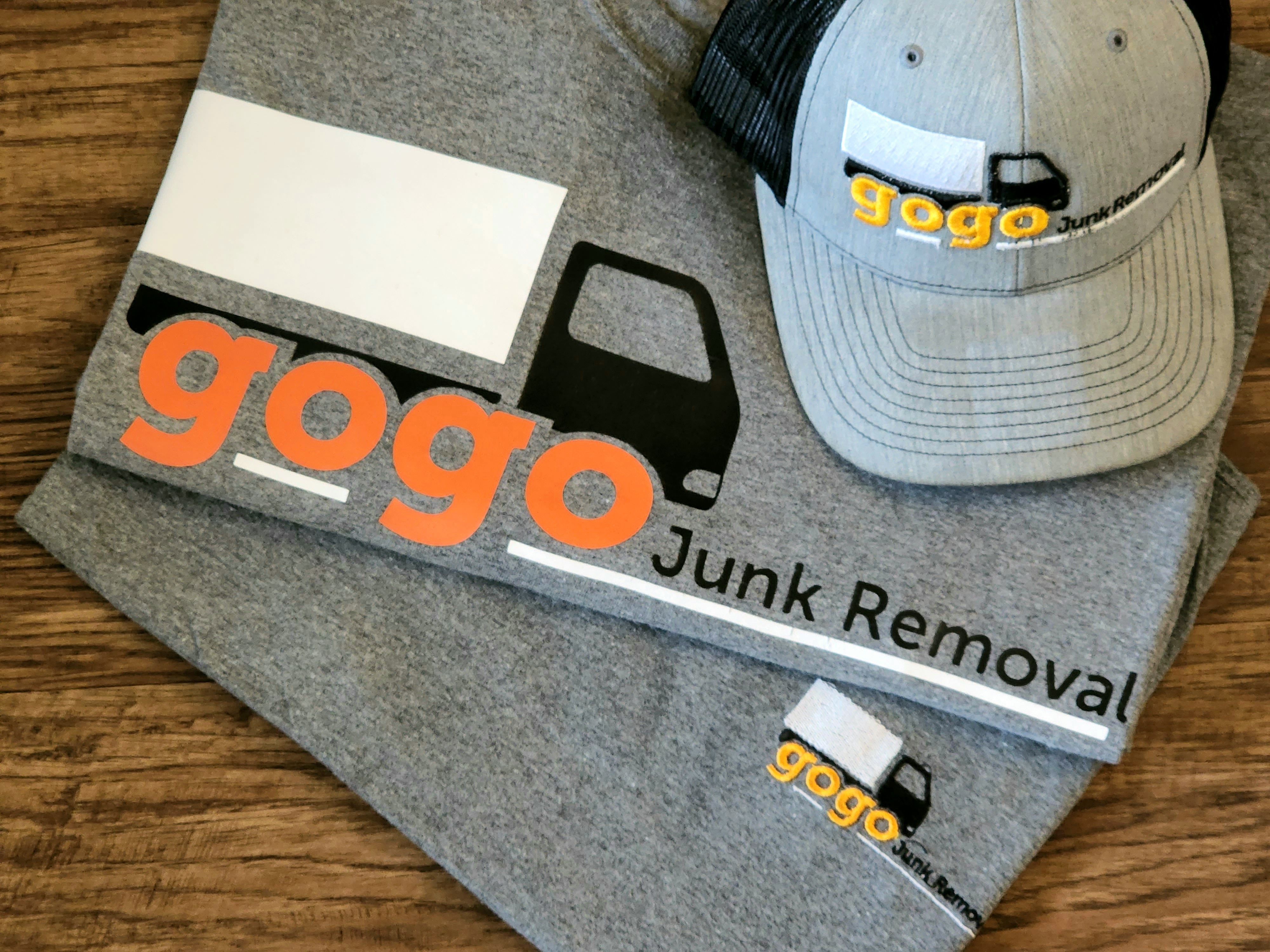 GoGo branded t-shirt and cap - professional uniform merchandise with orange truck logo for team