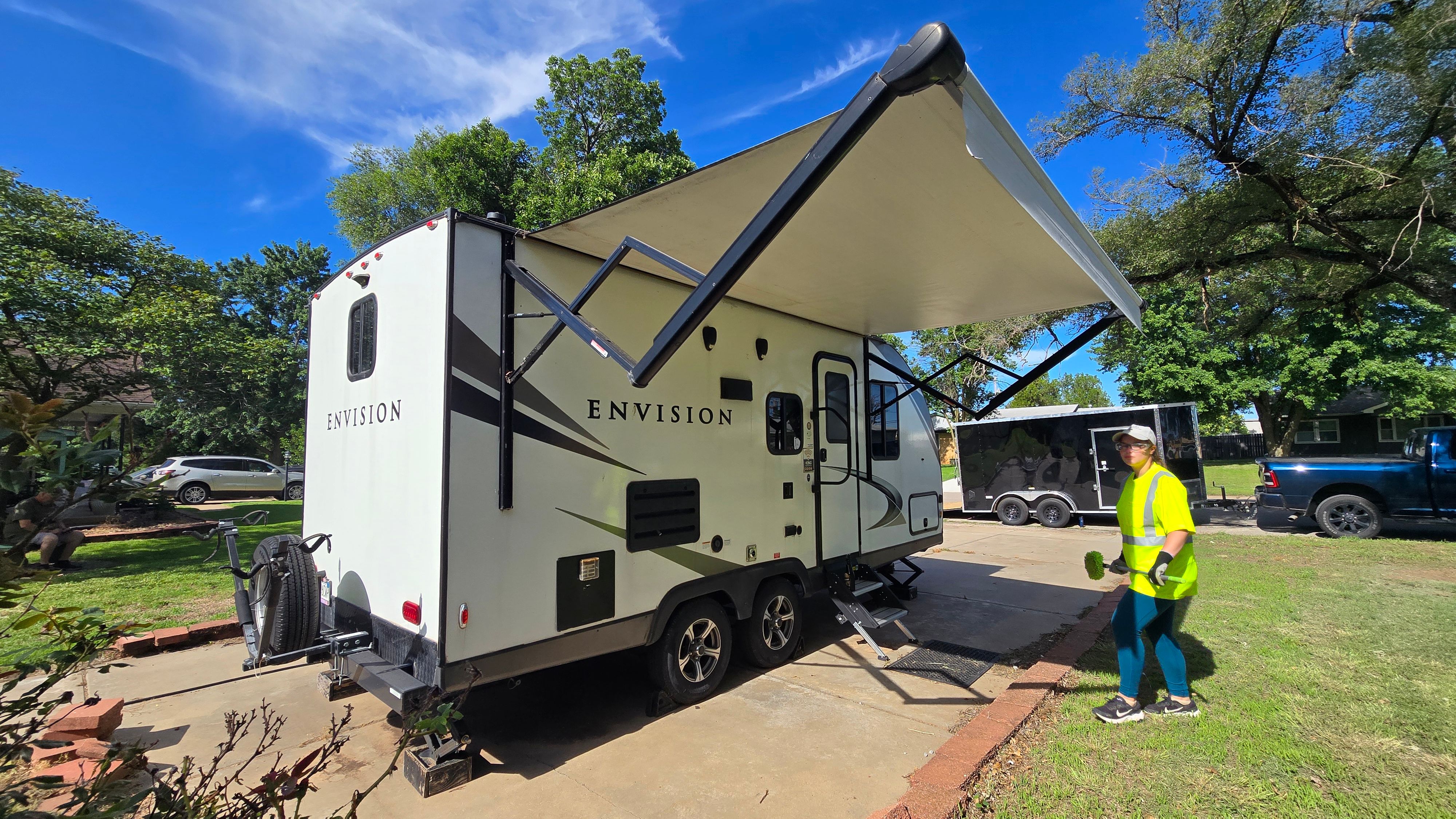 Donovan cleaning a travel trailer on-site