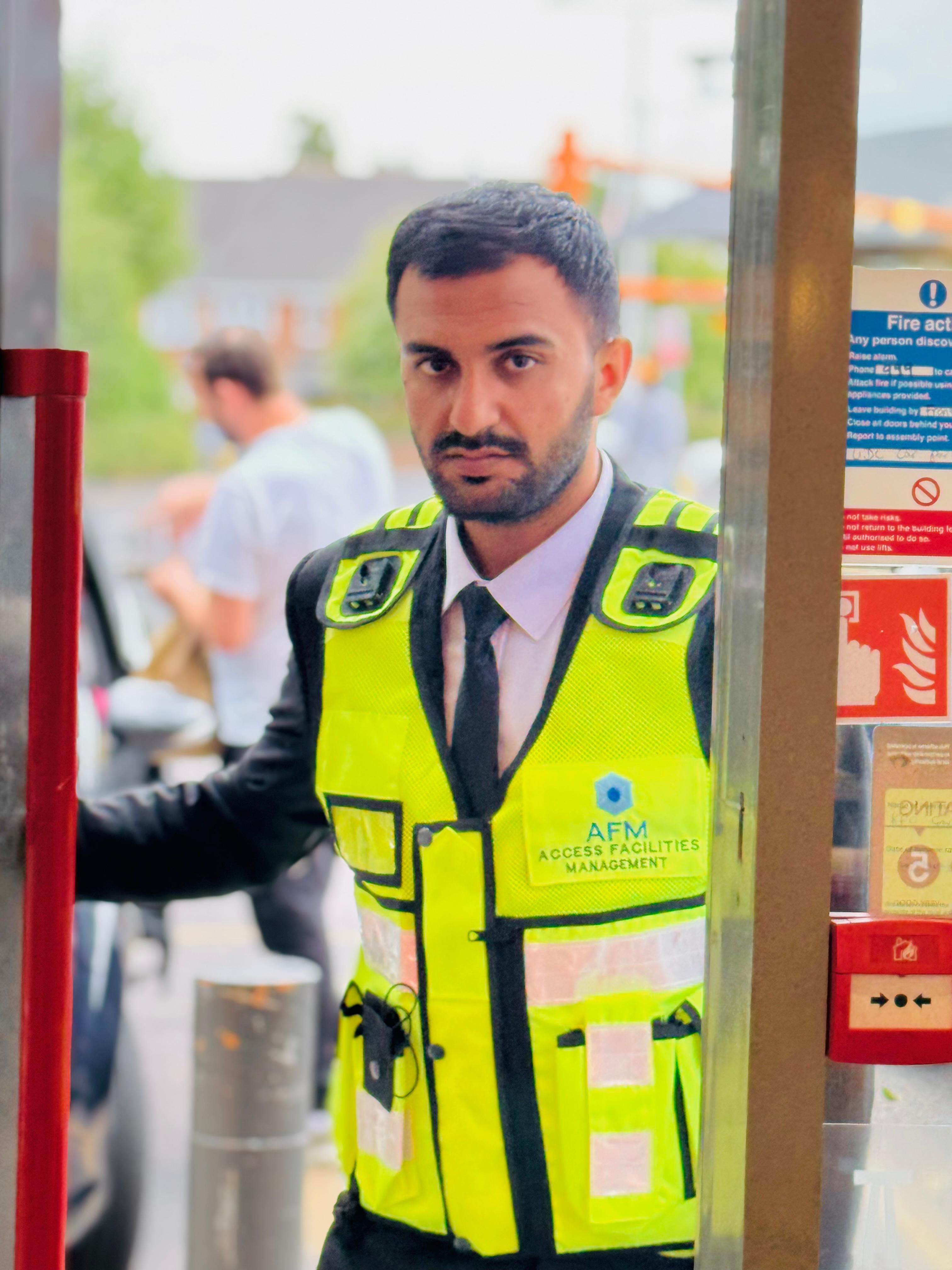 AFM officer holding door open at venue