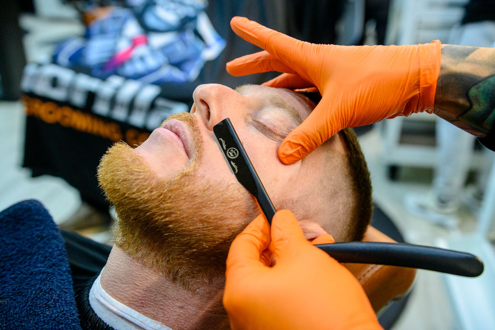 Straight razor shave close-up with hot towel treatment