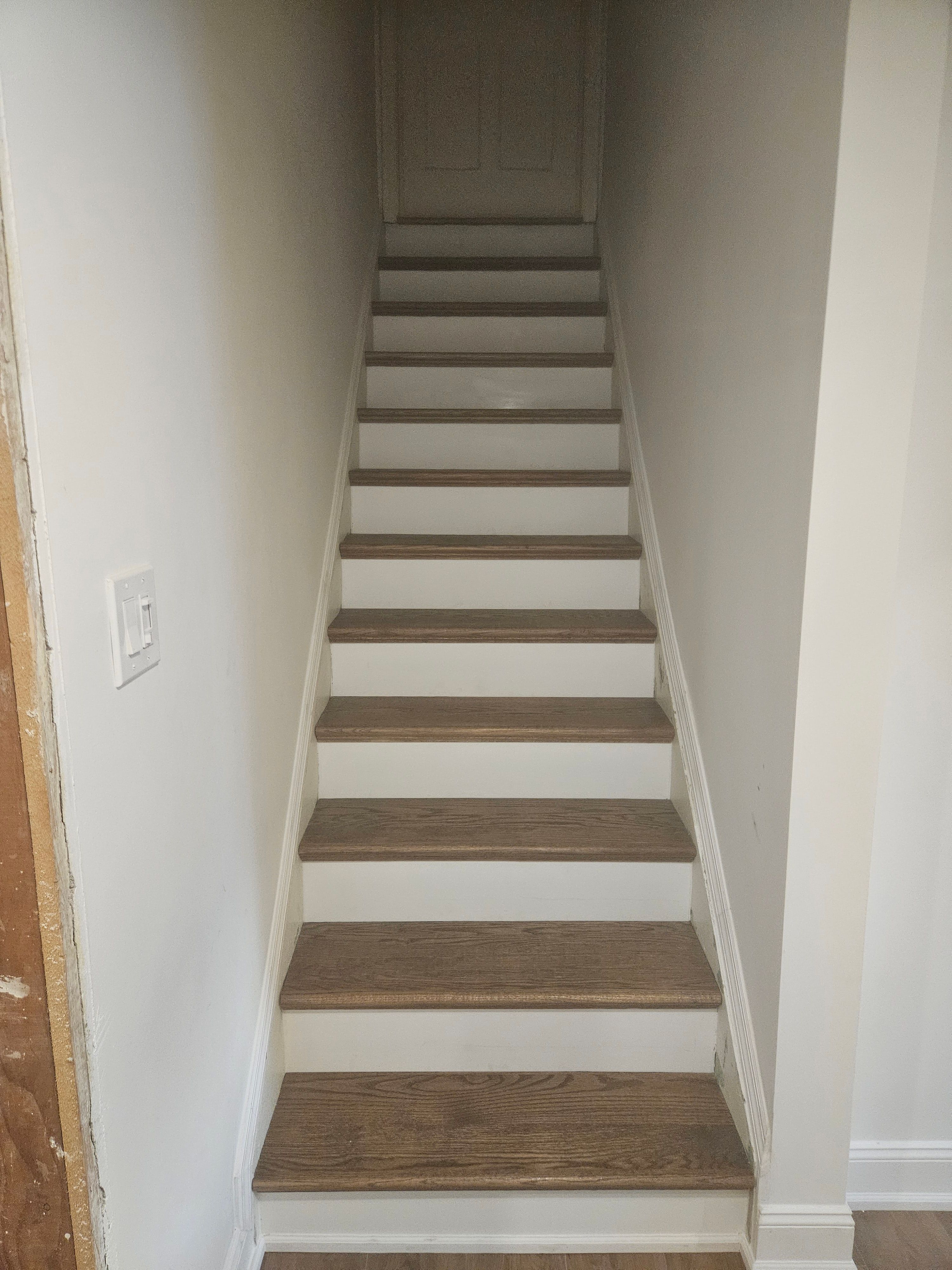 Custom staircase with new wooden steps and railing