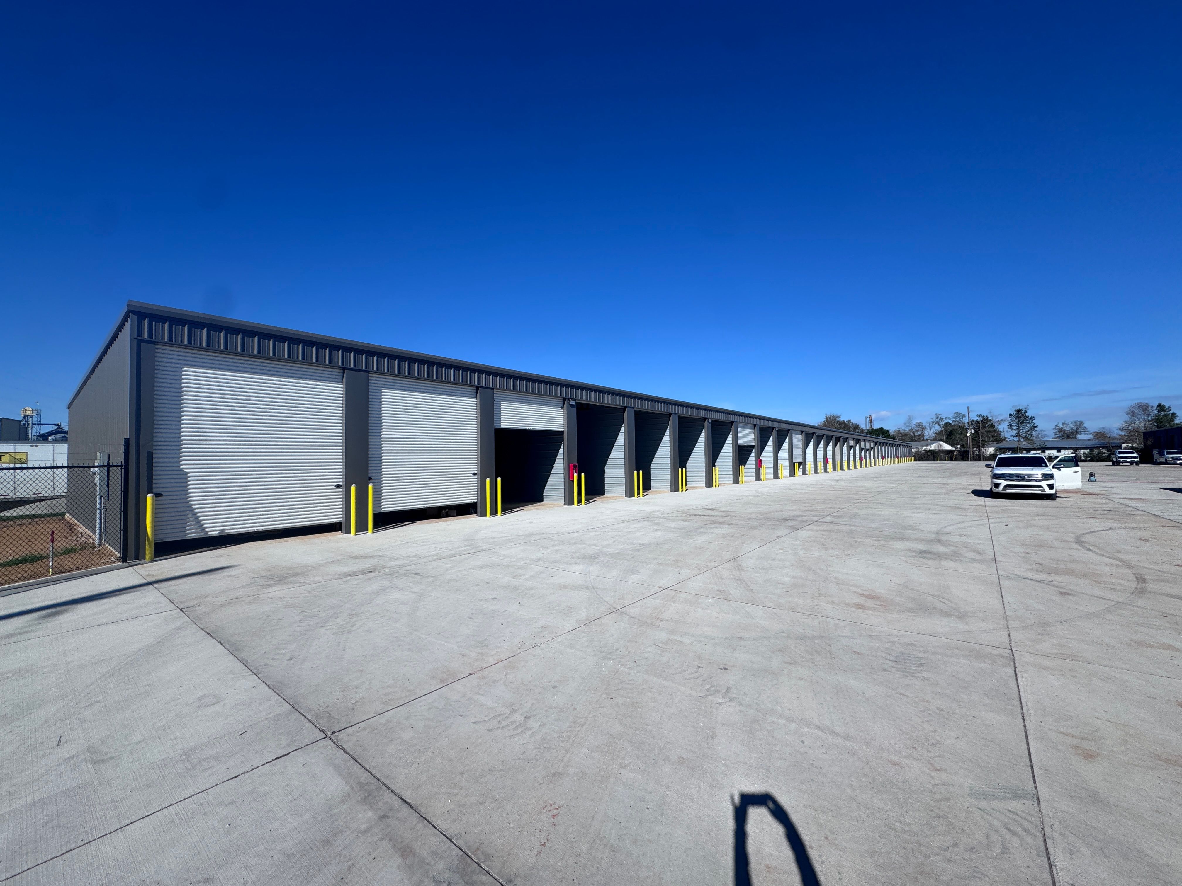 Enclosed storage building with roll-up doors