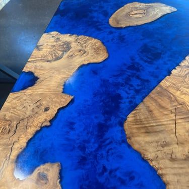 Close-up of blue epoxy and natural wood grain detail on custom Northshore furniture