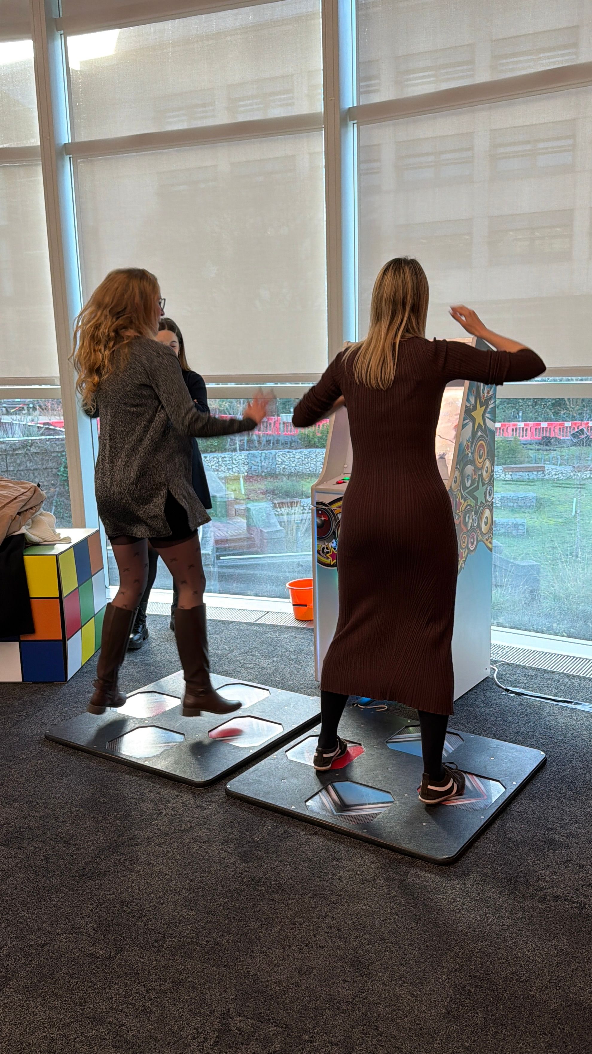 Retro arcade machines and dance games at a GSK corporate evening entertainment event by Event Collection