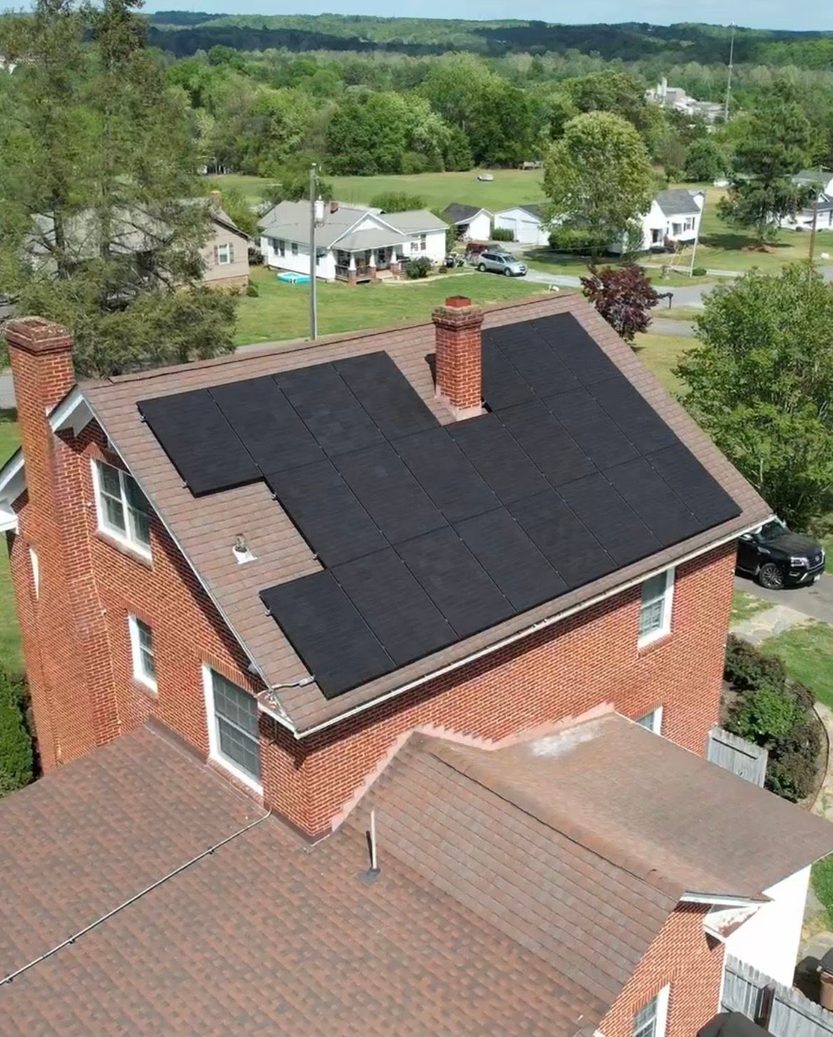 Finished solar project — aerial view of solar panels on roof