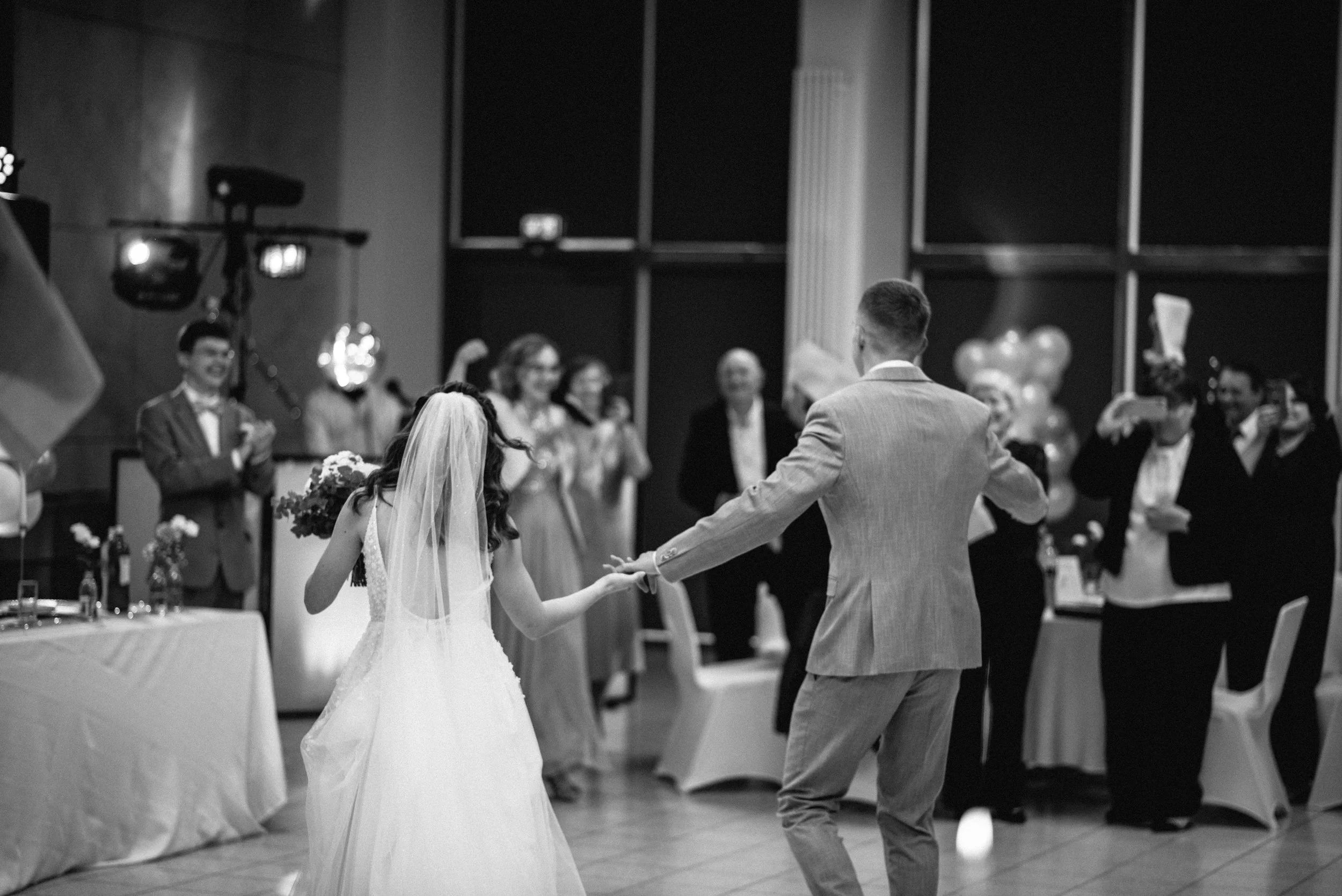 First dance in low light with flash, cinematic reception moment