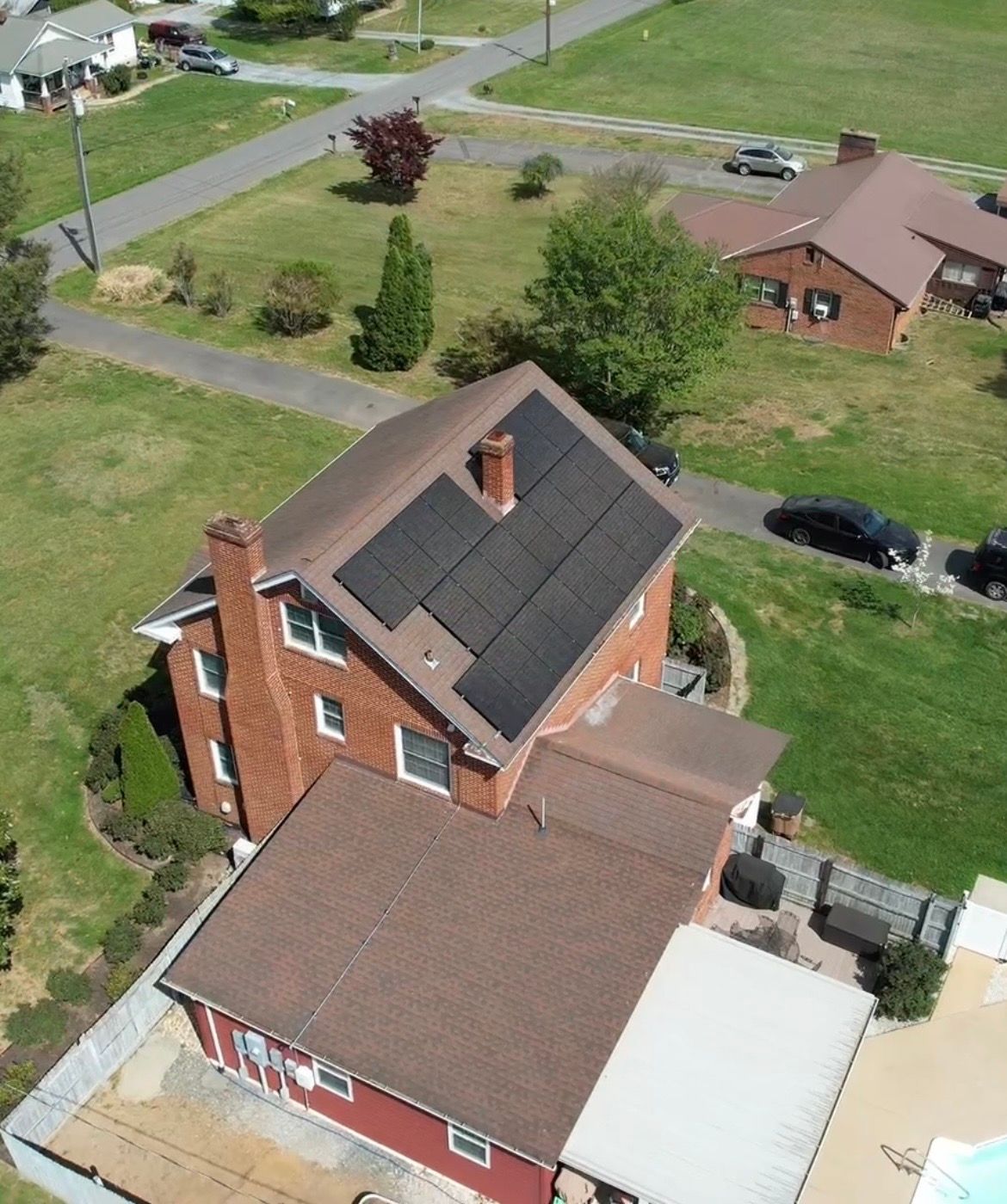 Finished solar project — brick home with solar panels